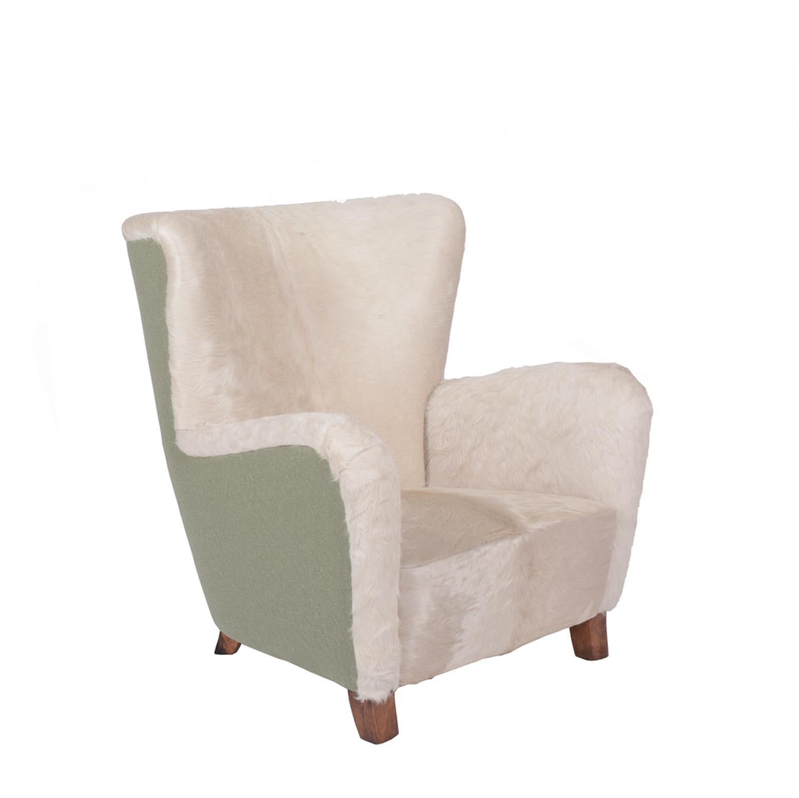 Newly upholstered wool fabric on outside and white argentine cow hide spring seat and back.