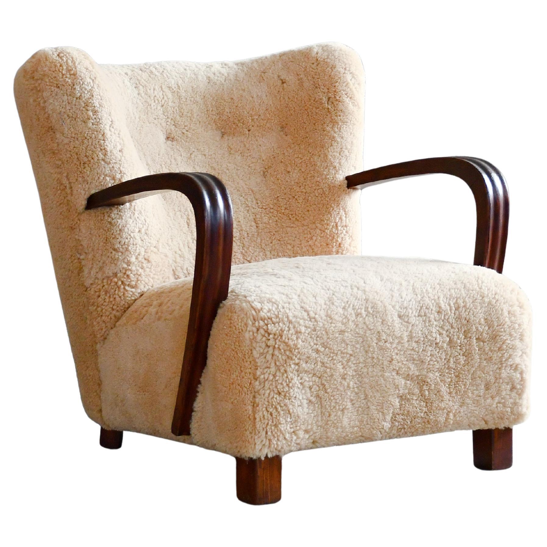Danish 1940's Easy Lounge Chair with Amber Shearling and Wooden Armrests For Sale
