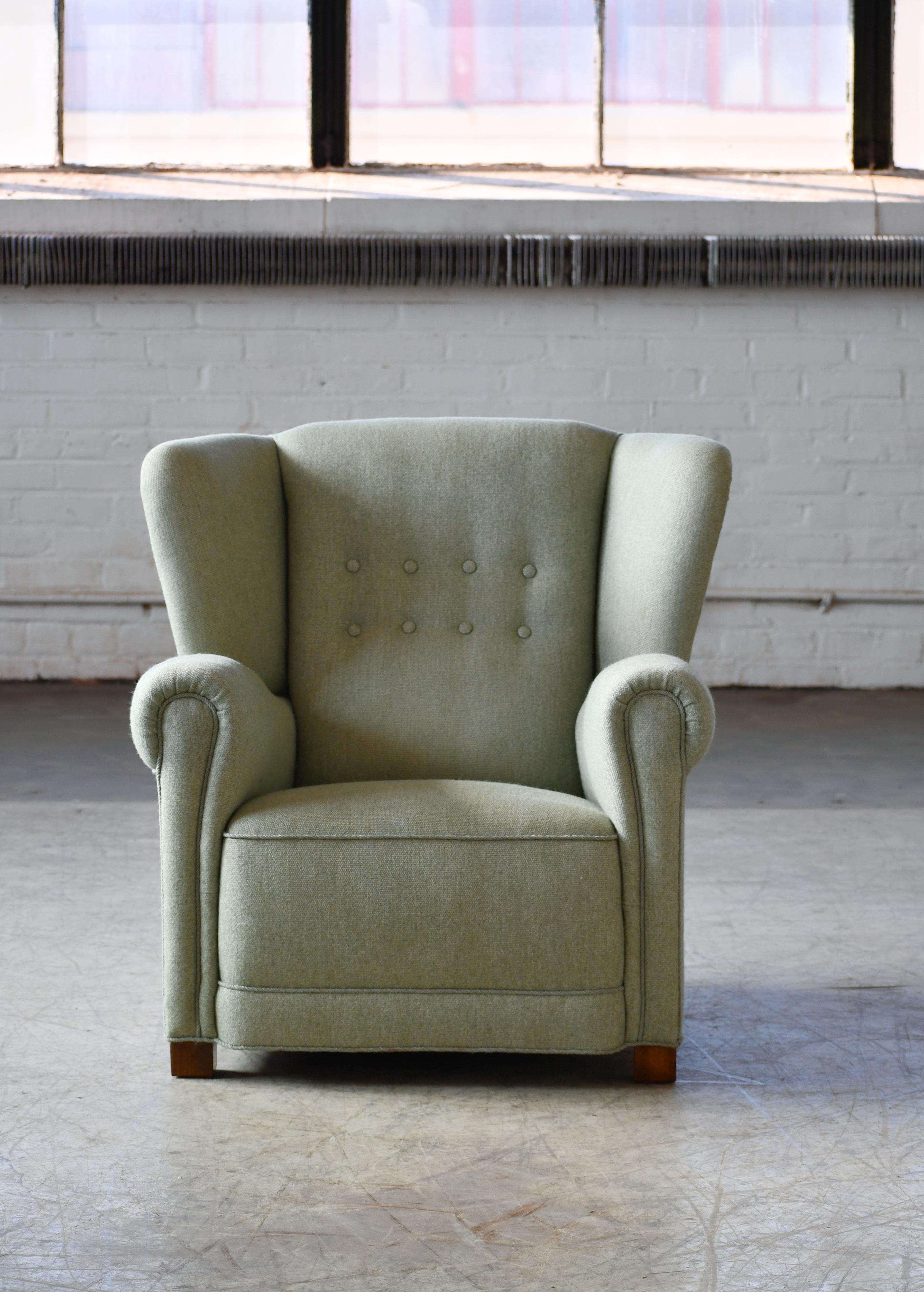 Superb and unique Classic Danish 1940s club chair in the style of Fritz Hansen. The chair has a nice stance and strong presence and is solid and sturdy while being superbly comfortable with coil springs in the seat and cushion. Overall very good