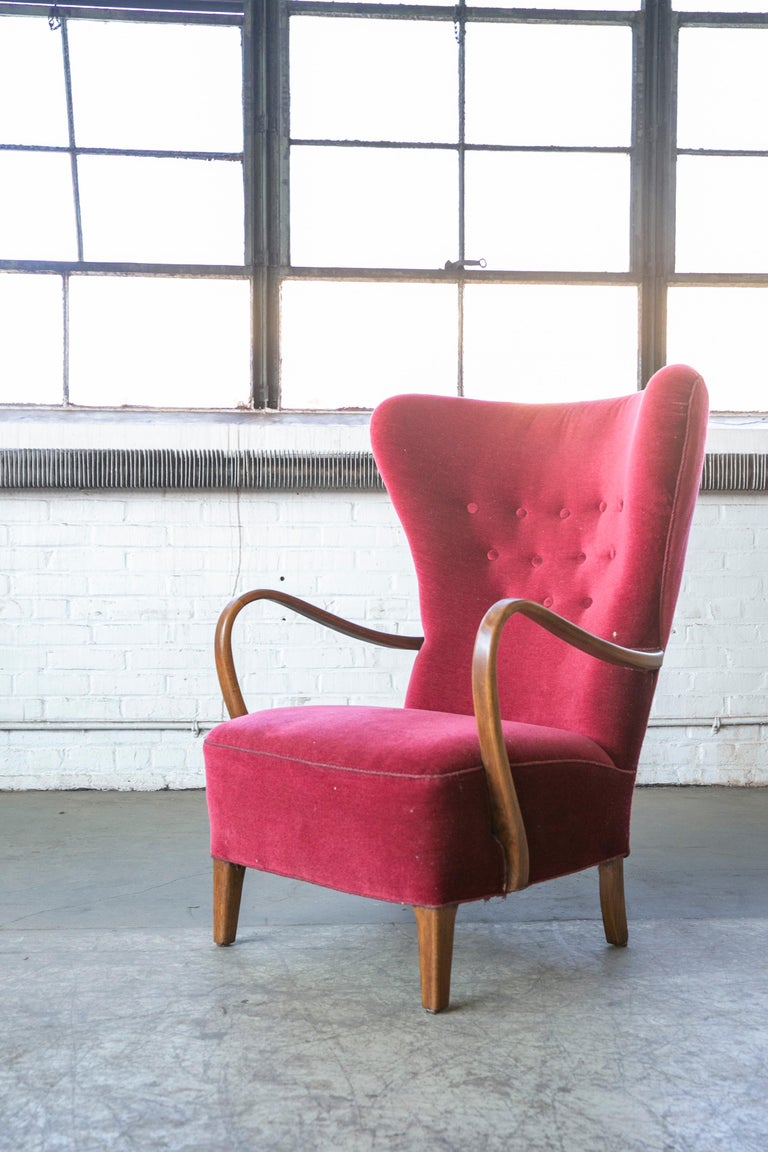Classic Danish very comfortable high back armchair from the 1940s in the style of Fritz Hansen and Alfred Christensen with open armrests in beautifully curved stained beech. Nice slim elegant silhouette. Solid and sturdy construction. The fabric and