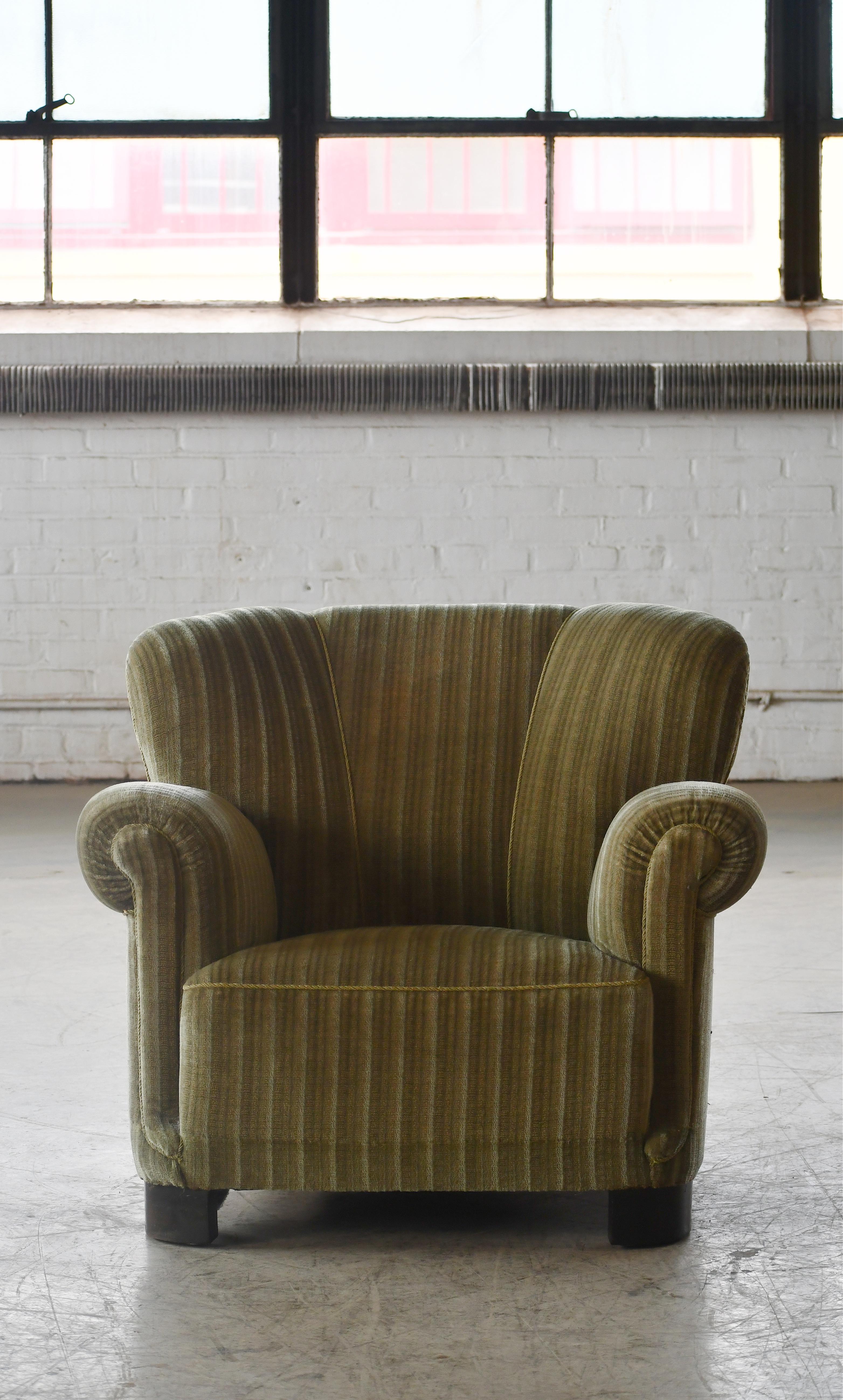 Classic Danish large-scale club or lounge chair very similar model 1518 by Fritz Hansen made in the late 1930-early 1940s. This chair has a lower backrest and higher armrests which provides for very cool lines. Super comfortable with coil springs in