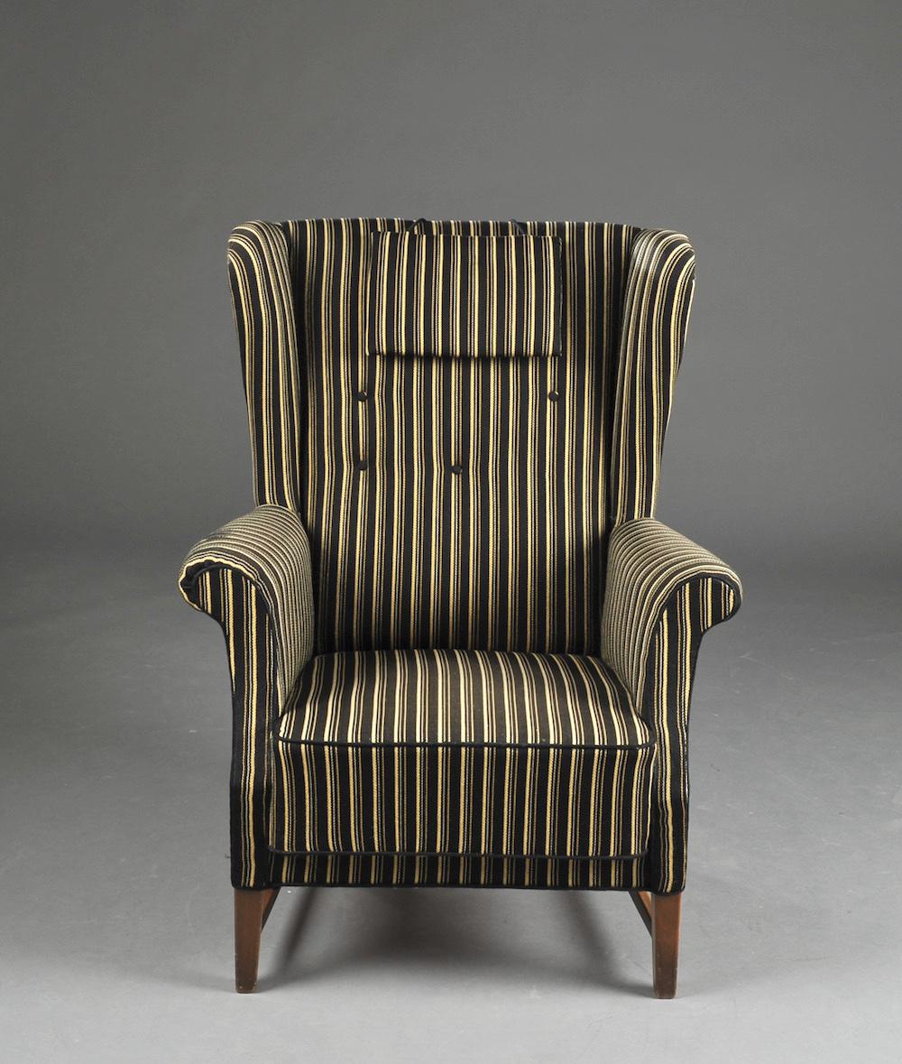 Danish 1940s high back wingchair with striped fabric upholstery.