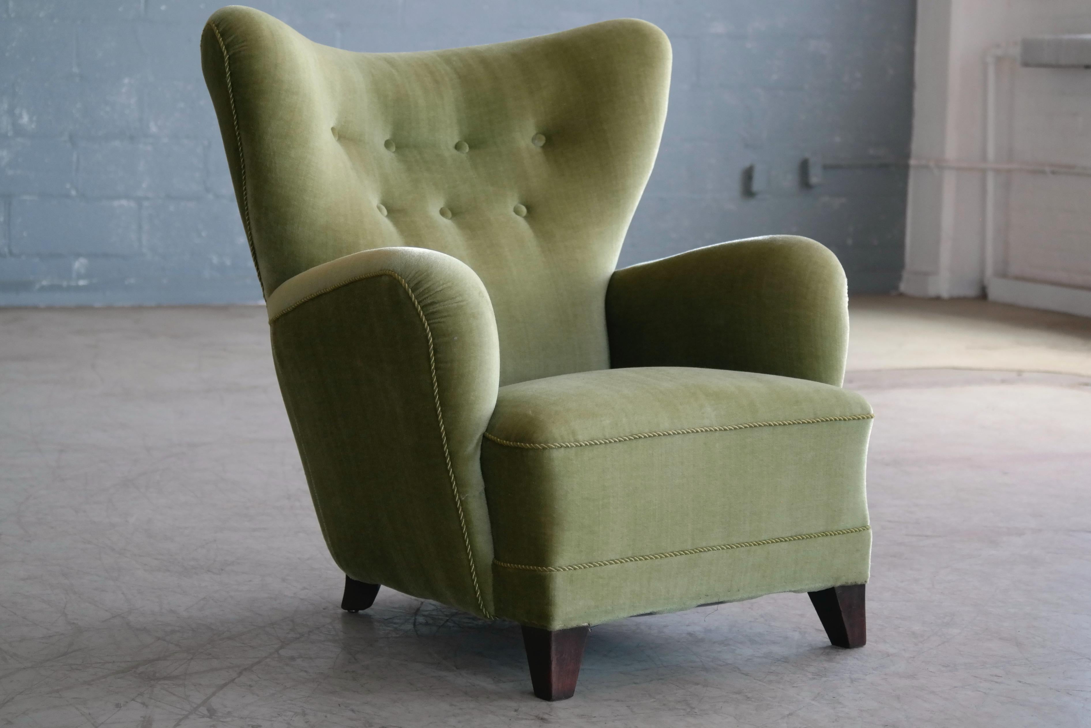 Incredibly comfortable, exuberant designed high back lounge chair in the style of Flemming Lassens famous 