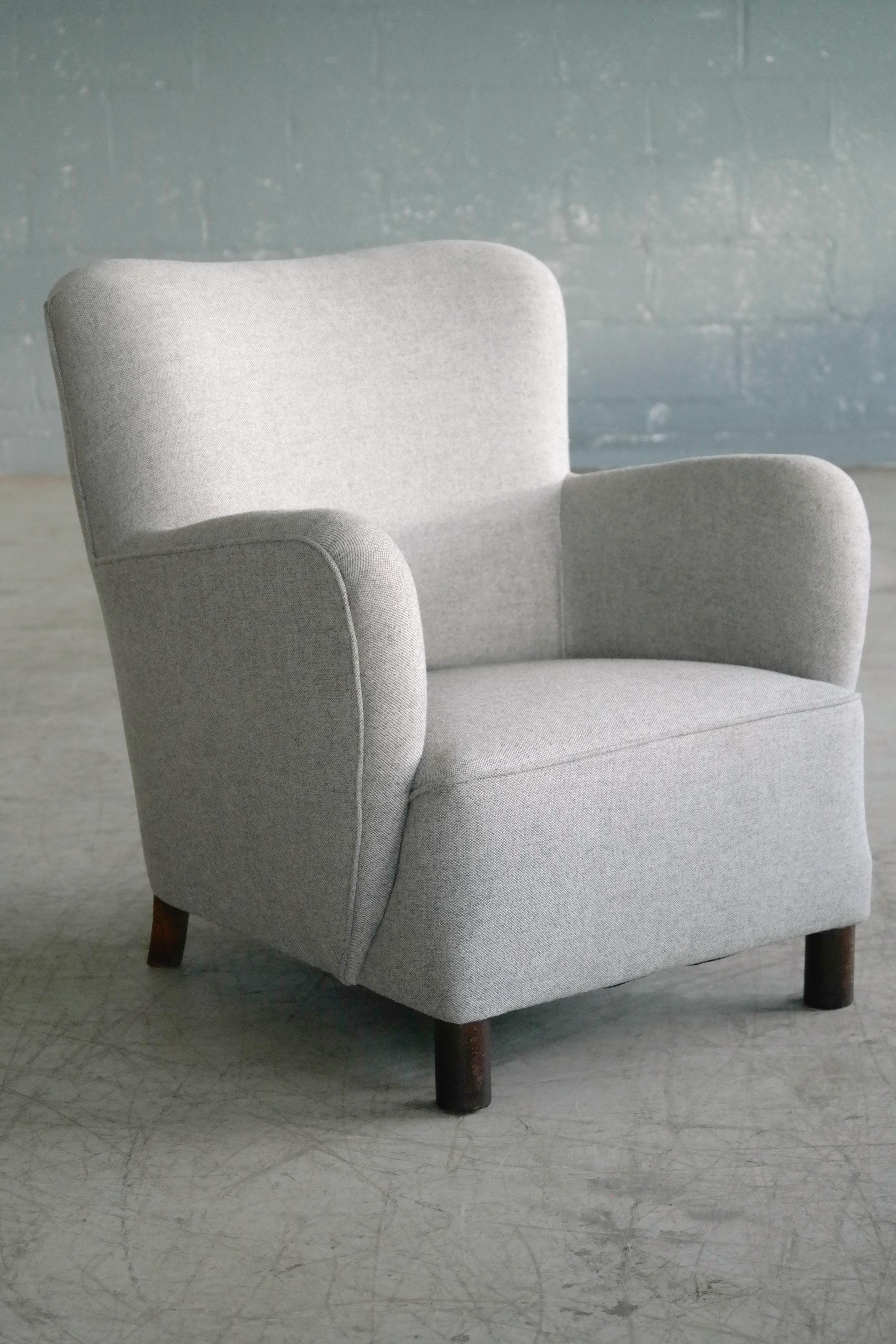 Rare to find Mogens Lassen attributed low back lounge chair from the 1940s featuring the rounded armrest design and the cylindrical front legs that are very characteristic of Lassen. Lassen's unique style is increasingly coveted and copied and for