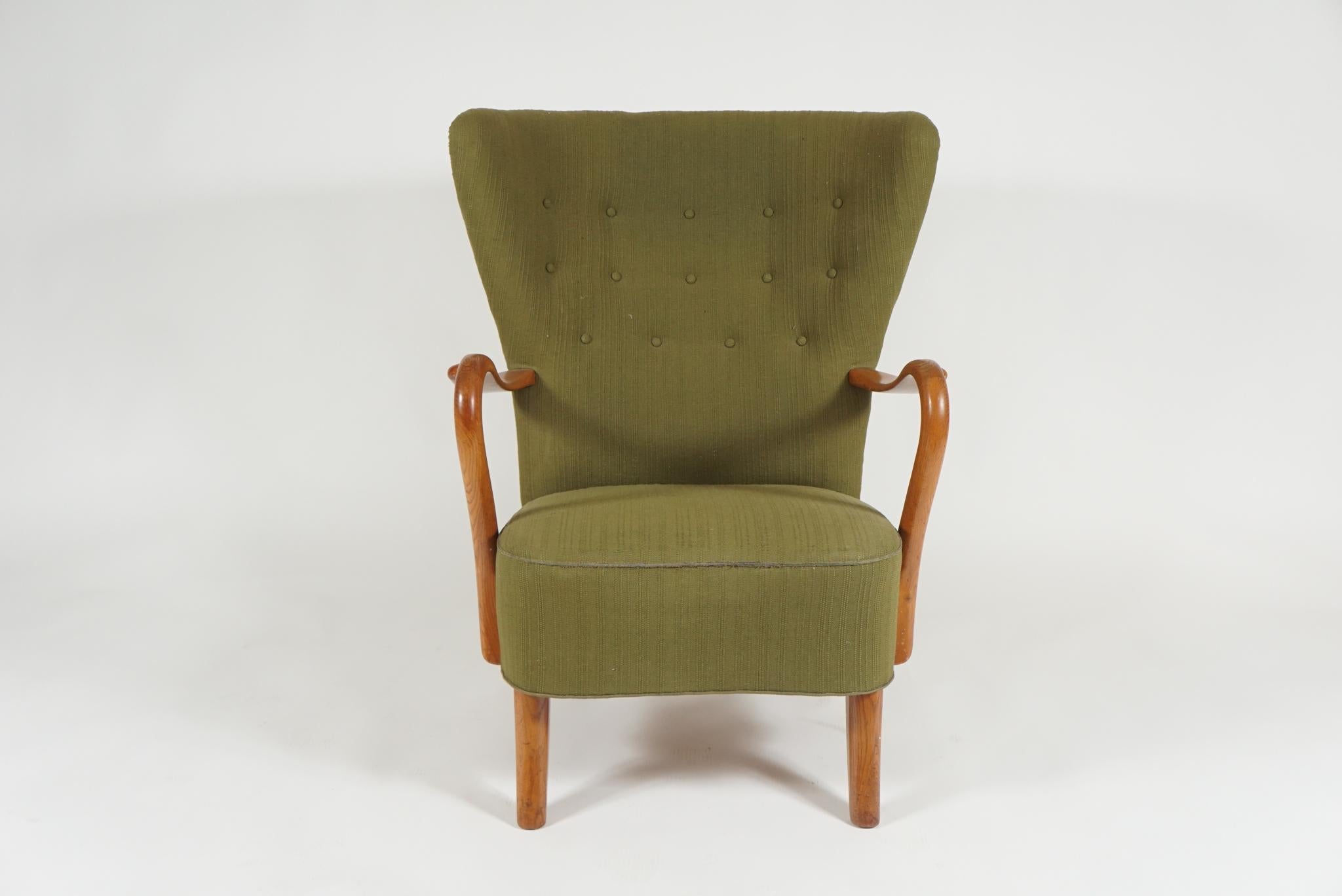 Danish 1940s open armchair with beechwood frame. This extremely comfortable chair is by designer Alfred Christensen.