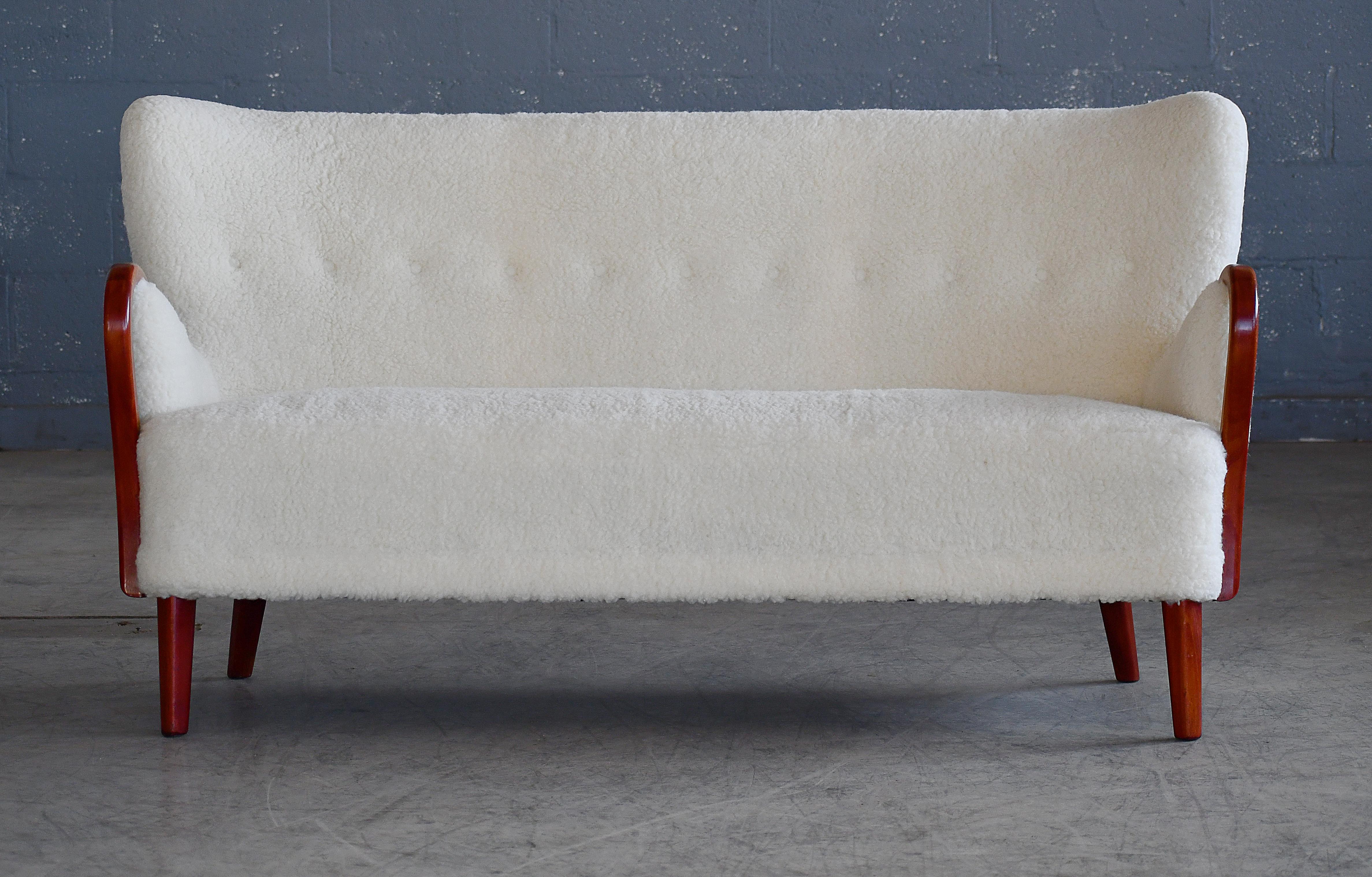 Mid-Century Modern Danish 1940s Sofa in Lambswool with Armrests in Carved Elm by Alfred Christensen For Sale