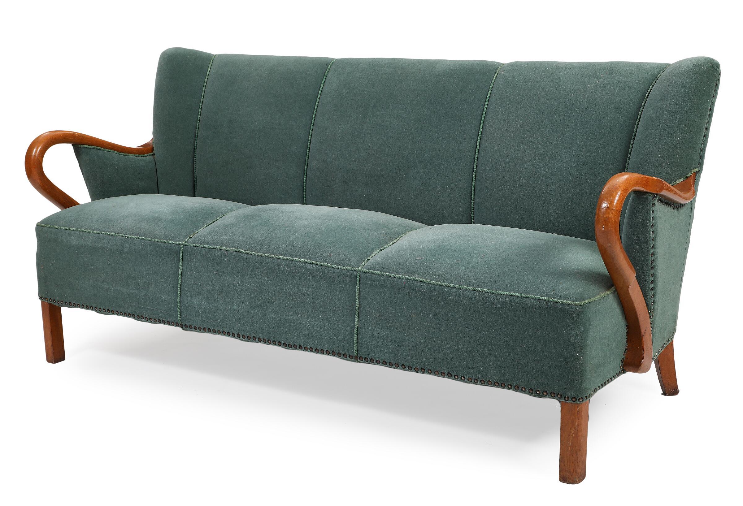 Fantastic 1940s Alfred Christensen designed sofa in his characteristic style of open armrests carved from solid elm wood and made by Slagelse Mobelvaerk in the 1940s. Beautiful refined lines with curving arms, coil springs in the seat and tufted