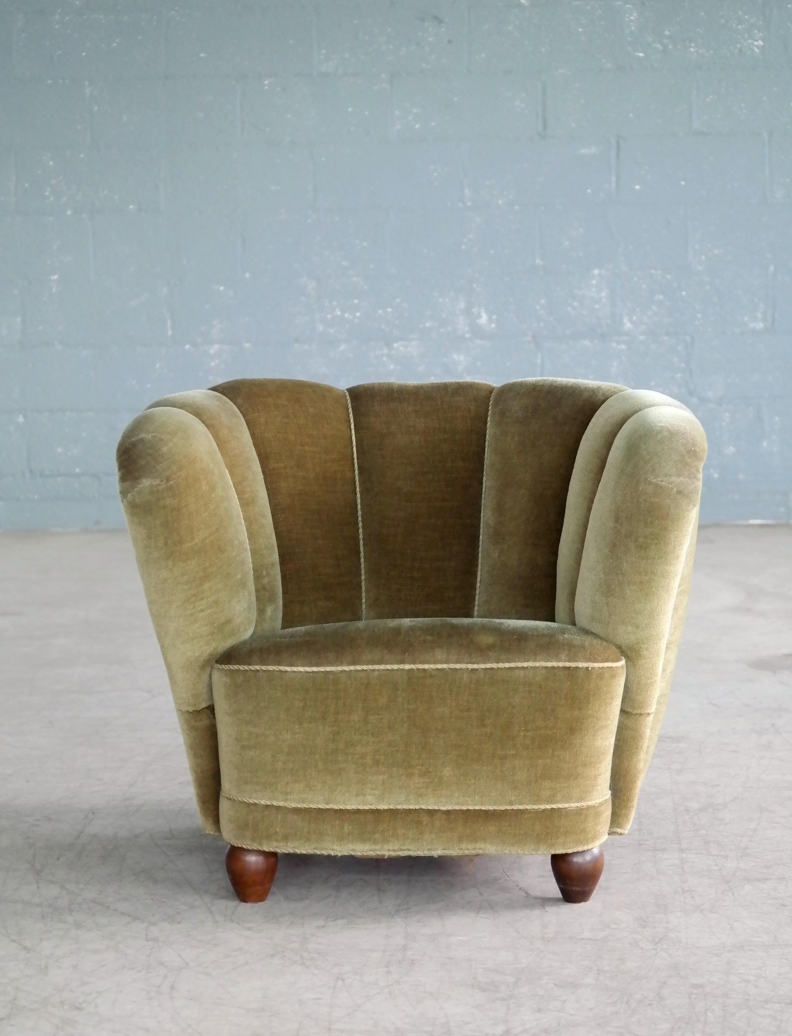 1940s Danish curved chair is an actually match the Danish curved or banana form sofas as they are also called. The sofas and chairs were very popular coming out of the 1930s and into the early 1940s and inspired by the Art Deco period. This chair