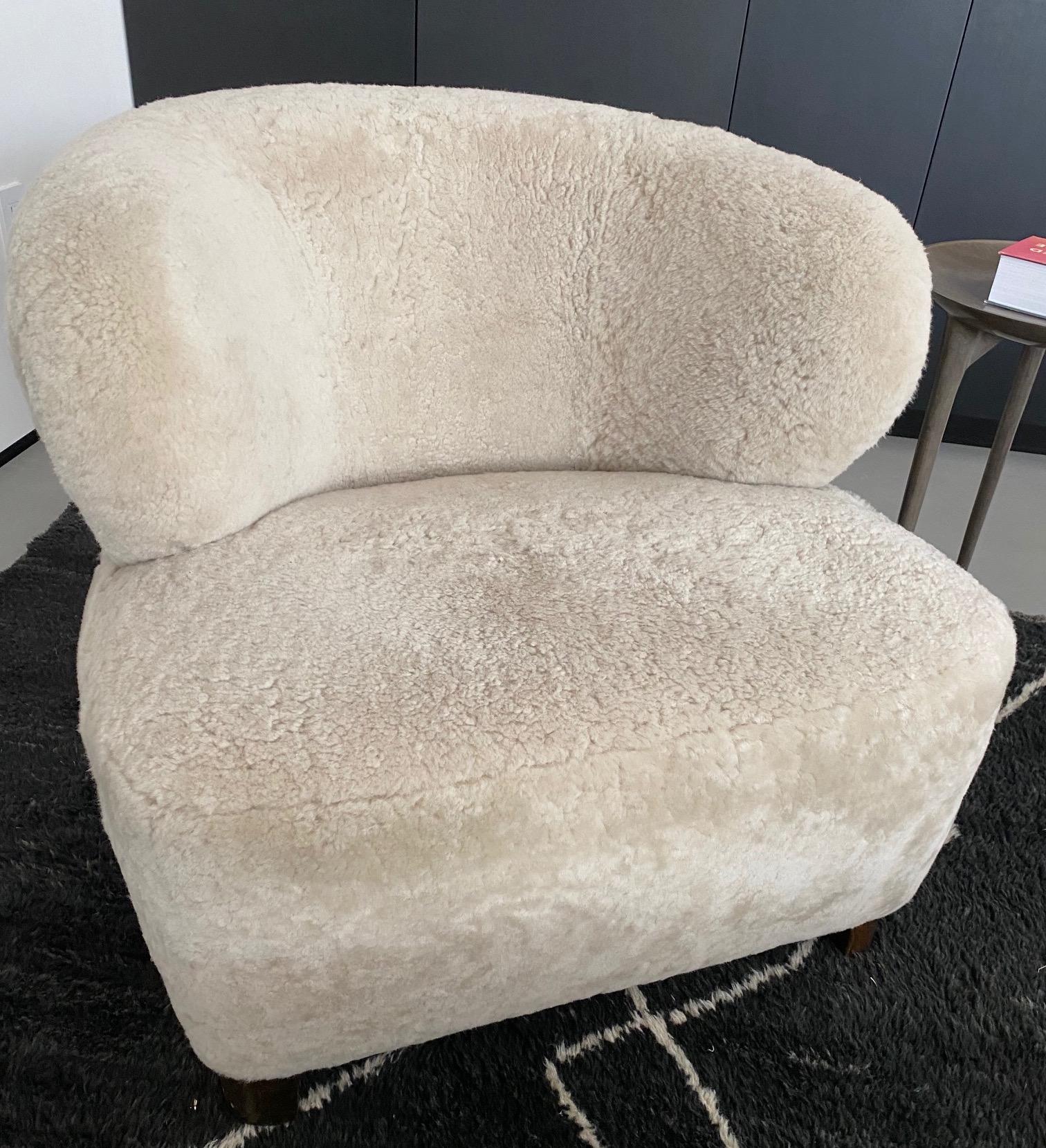 Incredibly comfortable lounge chair produced in Denmark in the 1940s.
Refurbished in 2019 and reupholstered in high quality cream shearling.