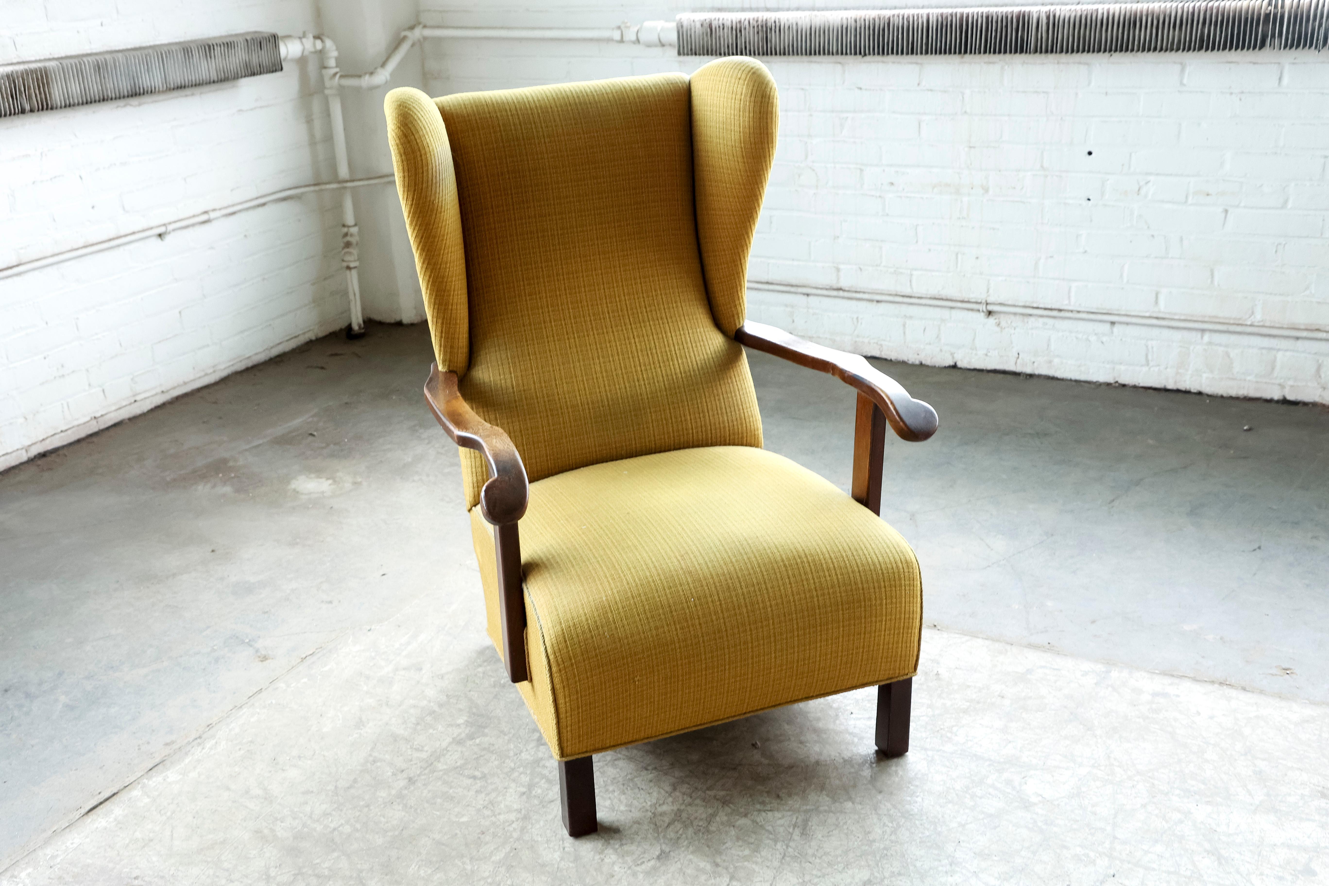 Mid-20th Century Danish 1940's Wingback Lounge Chair with Armrests in Oak and Rocking Function