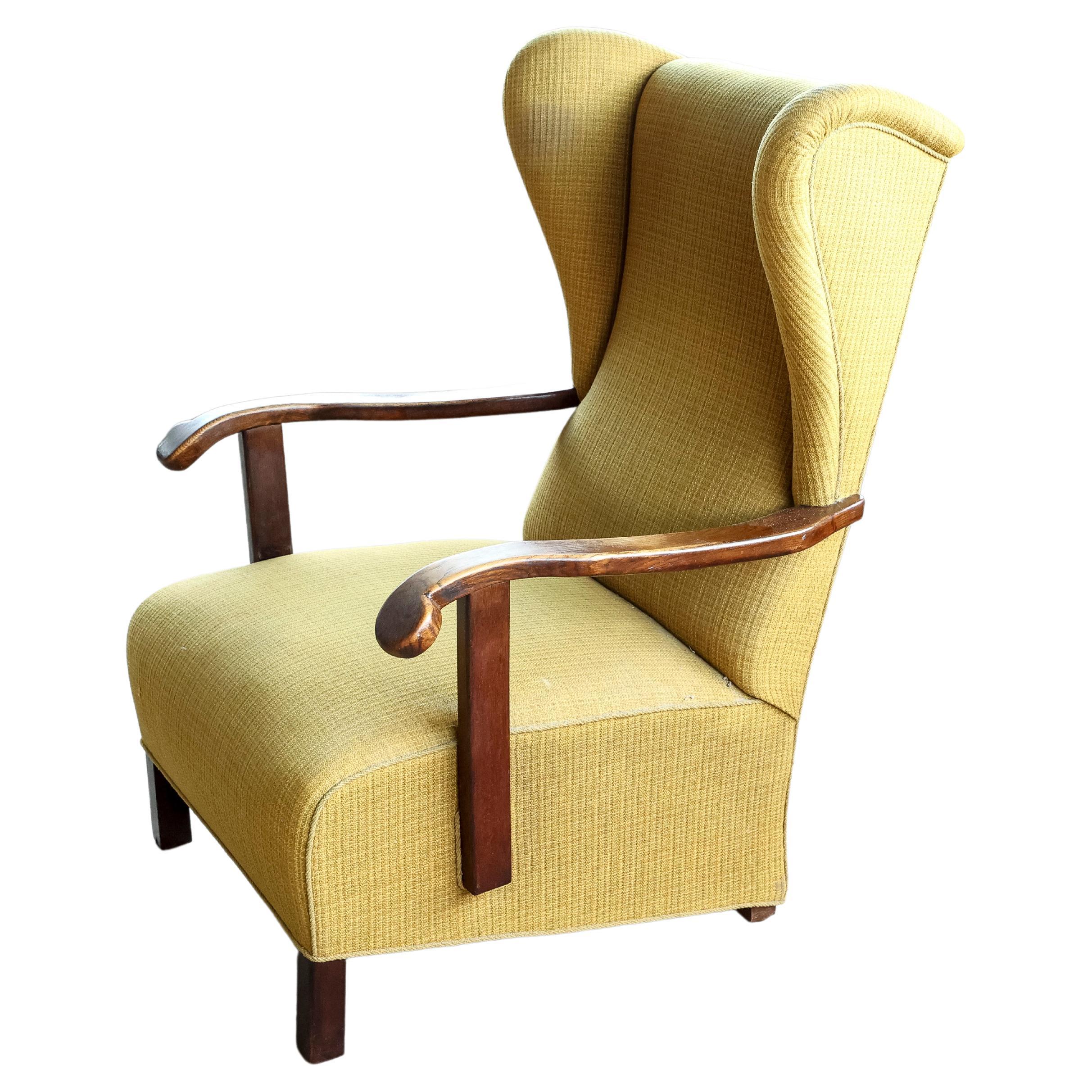 Danish 1940's Wingback Lounge Chair with Armrests in Oak and Rocking Function