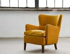 Fauteuil danois de 1950 à dossier bas, avec coussin en duvet
