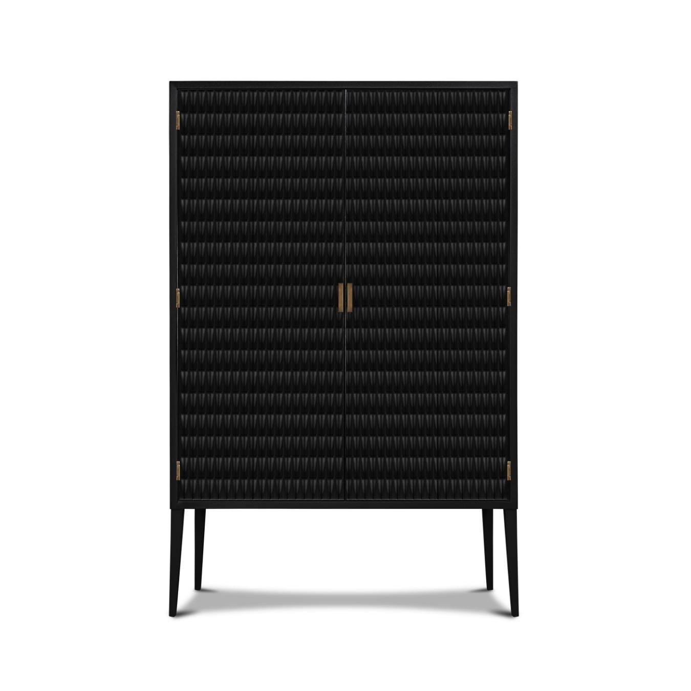 Inspired by Danish designs from the 50’s, the Vance armoire is a beautiful example of fine craftsmanship. The door’s design has an arrow-shaped texture that makes the cabinet unique. The interior is painted in red and has a simple black metal