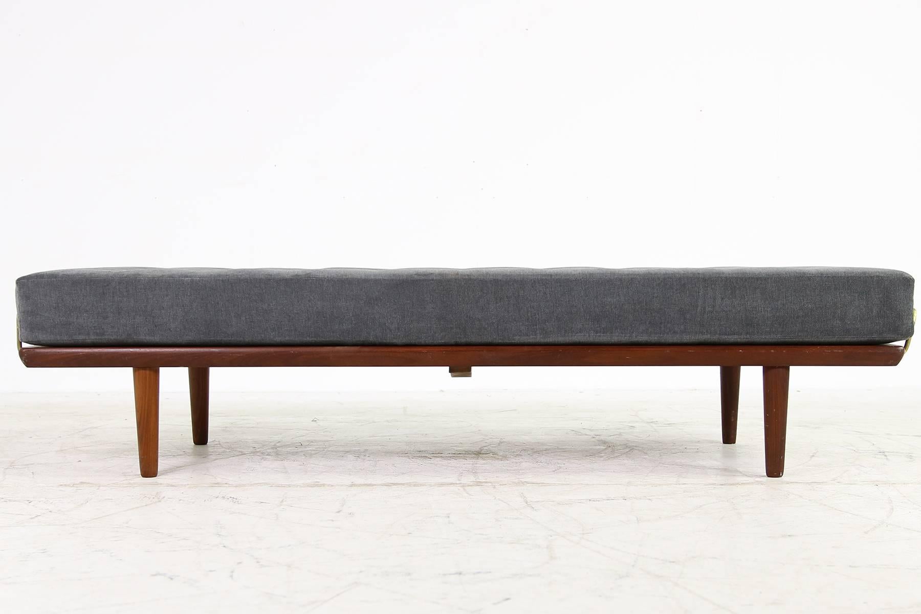 Amazing 1950s Hans J. Wegner daybed, model GE19 for GETAMA, Denmark. Very good condition, the original mattress was reupholstered and covered with new, high quality soft woven fabric in dark grey. The teak wood frame is in a fantastic condition.
