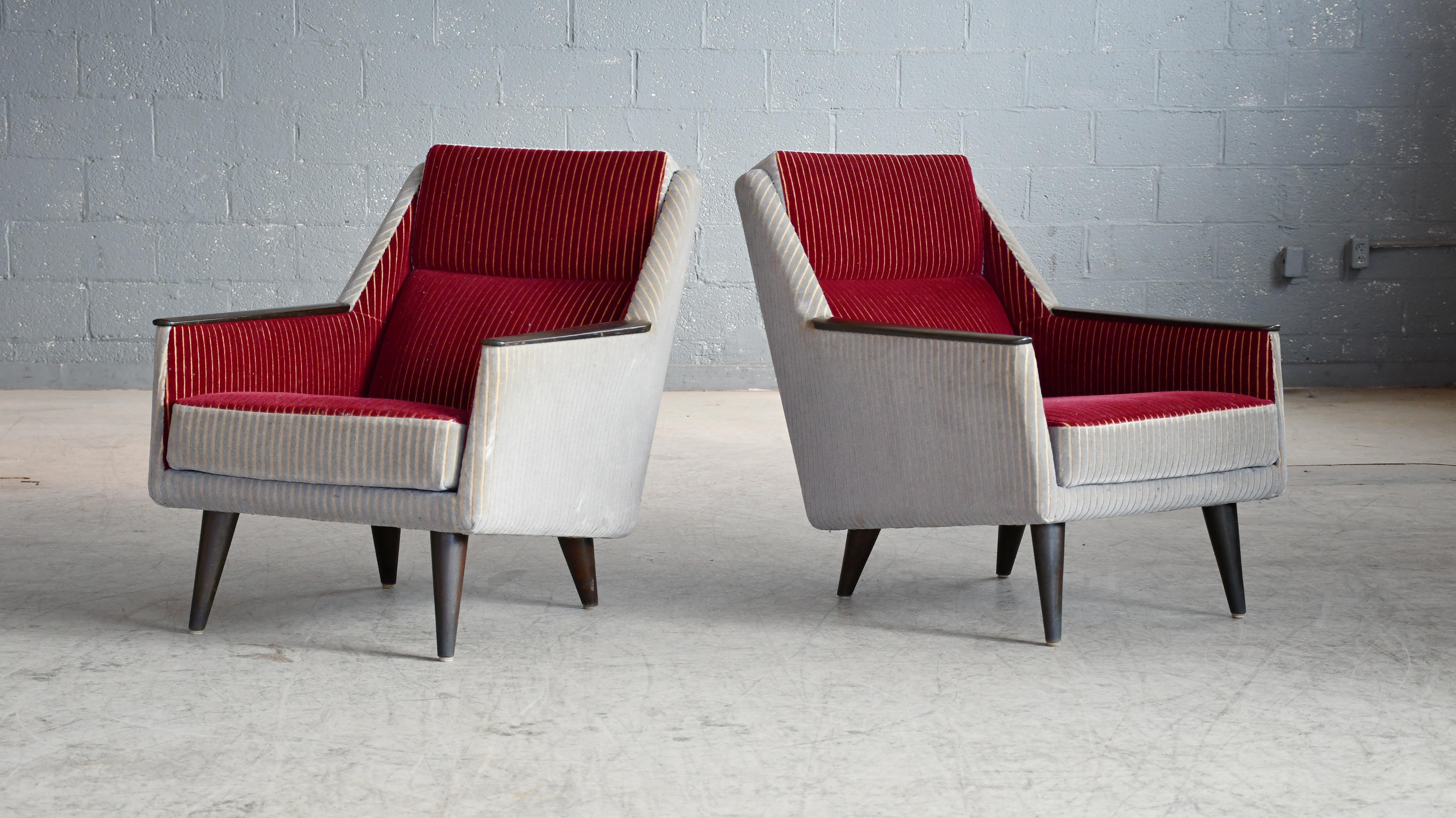 Very cool Danish pair of midcentury lounge chairs with beech legs and beech accents on the armrests.  Epitomizes the style from around 1950. We were starting to see lower profiles of furniture as new production methods were being introduced. These