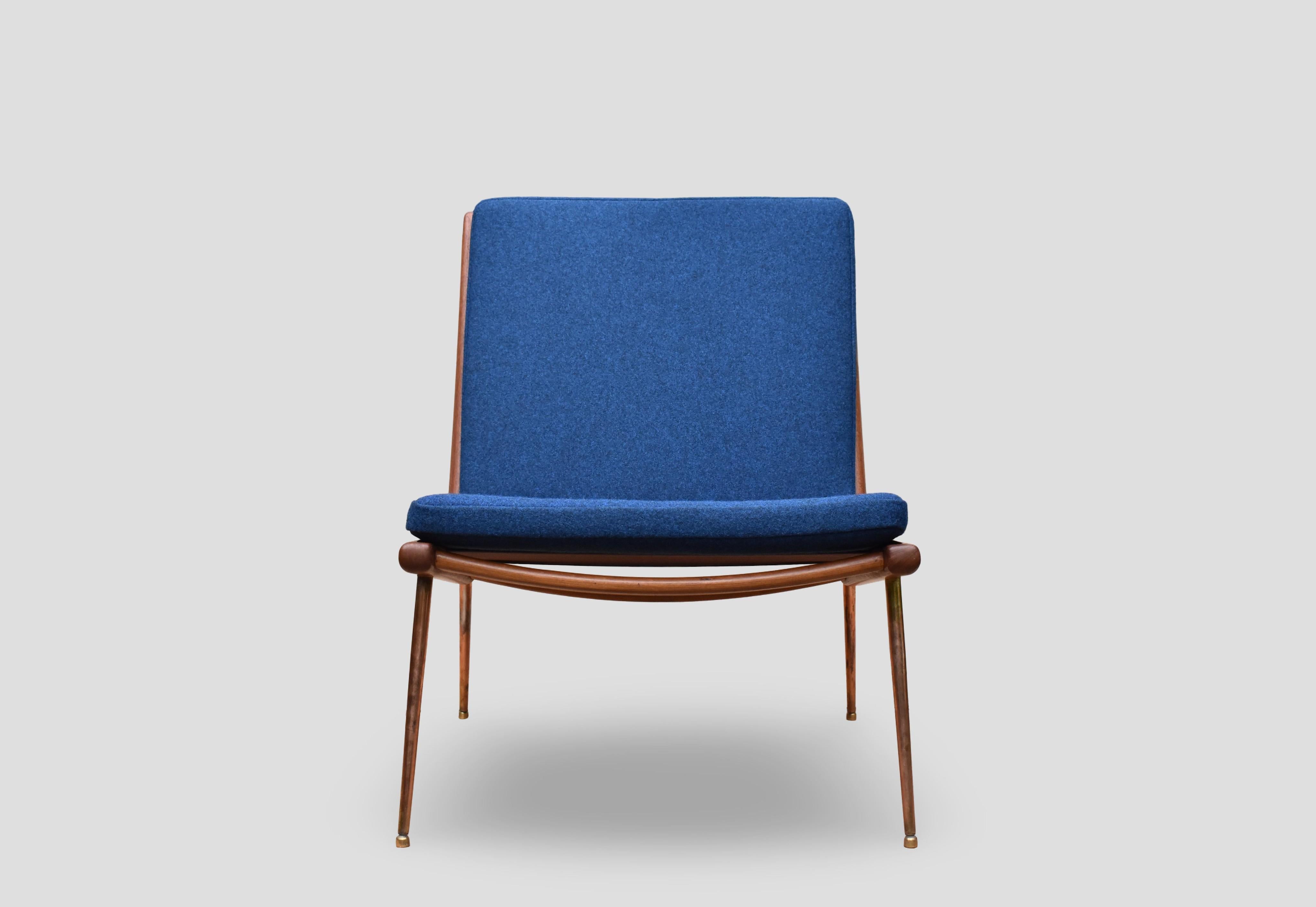 Designed by Architects Peter Hvidt & Orla Molgaard Nielsen in 1954 the Boomerang chair is one of the most elegant chair designs of the Mid Century period.

Often looking more Italian than Danish in origin the beautifully crafted frame stands on slim