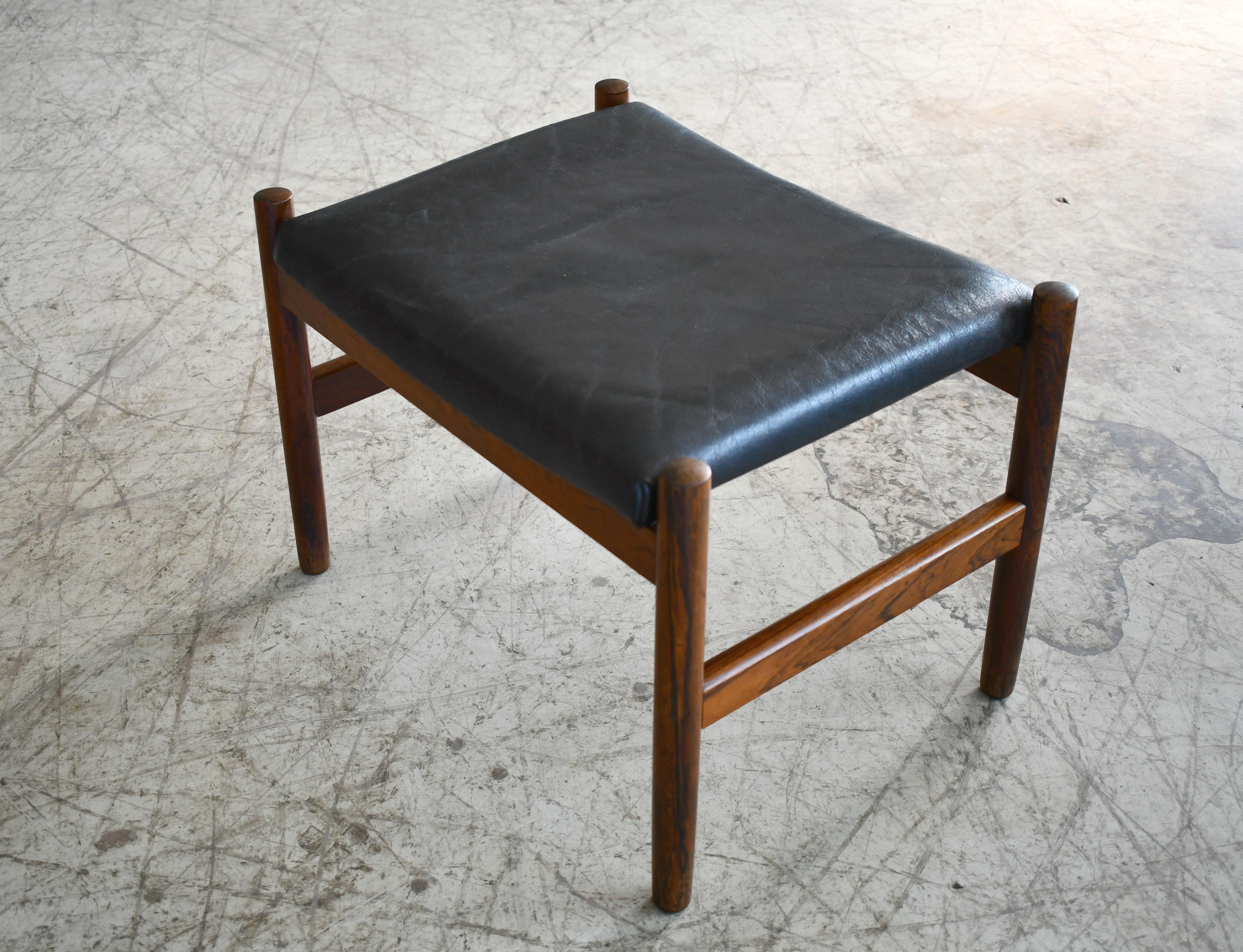 black leather and wood ottoman