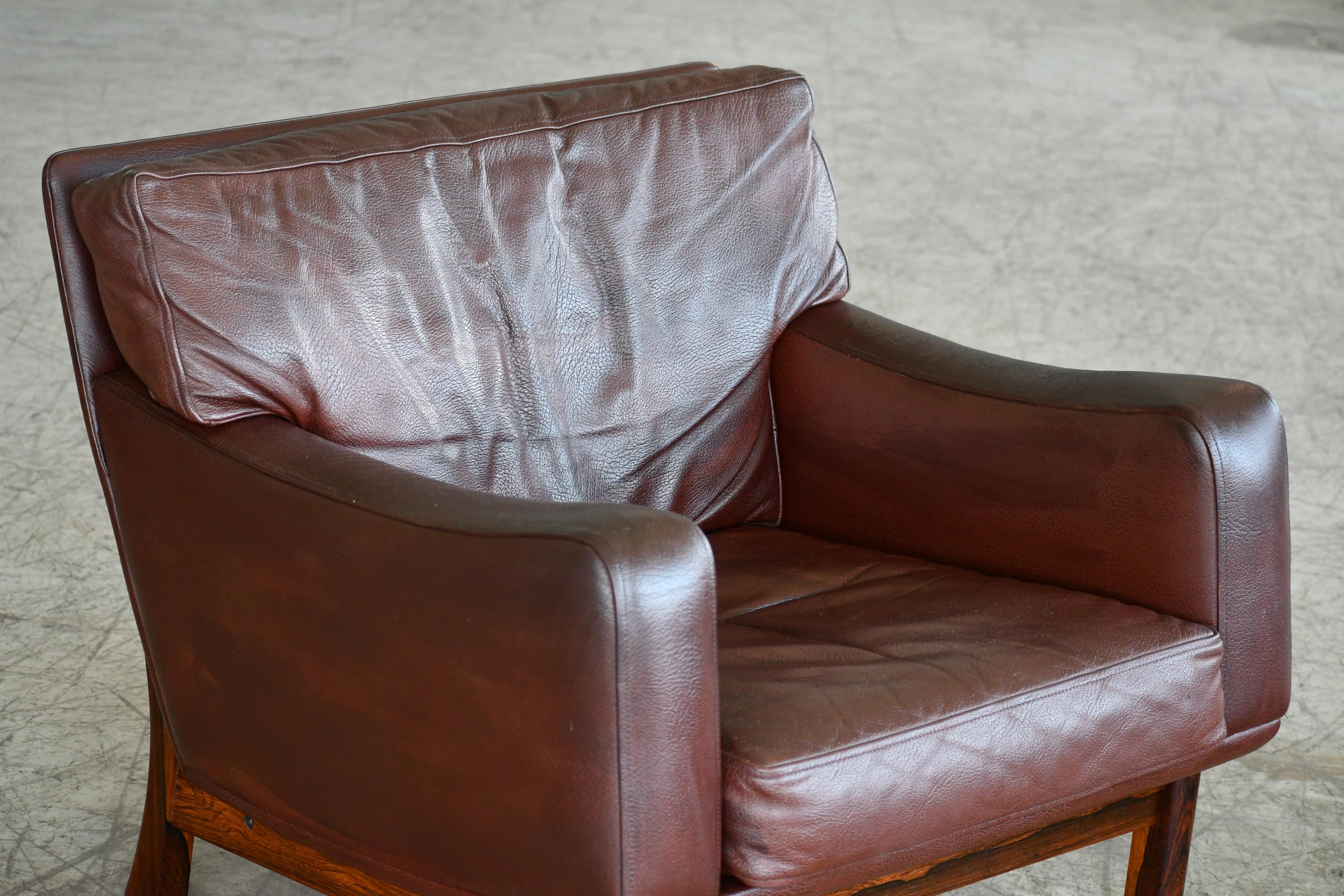 Mid-Century Modern Danish 1960s Lounge Chair in Brown Leather and Rosewood by Erhardsen & Andersen