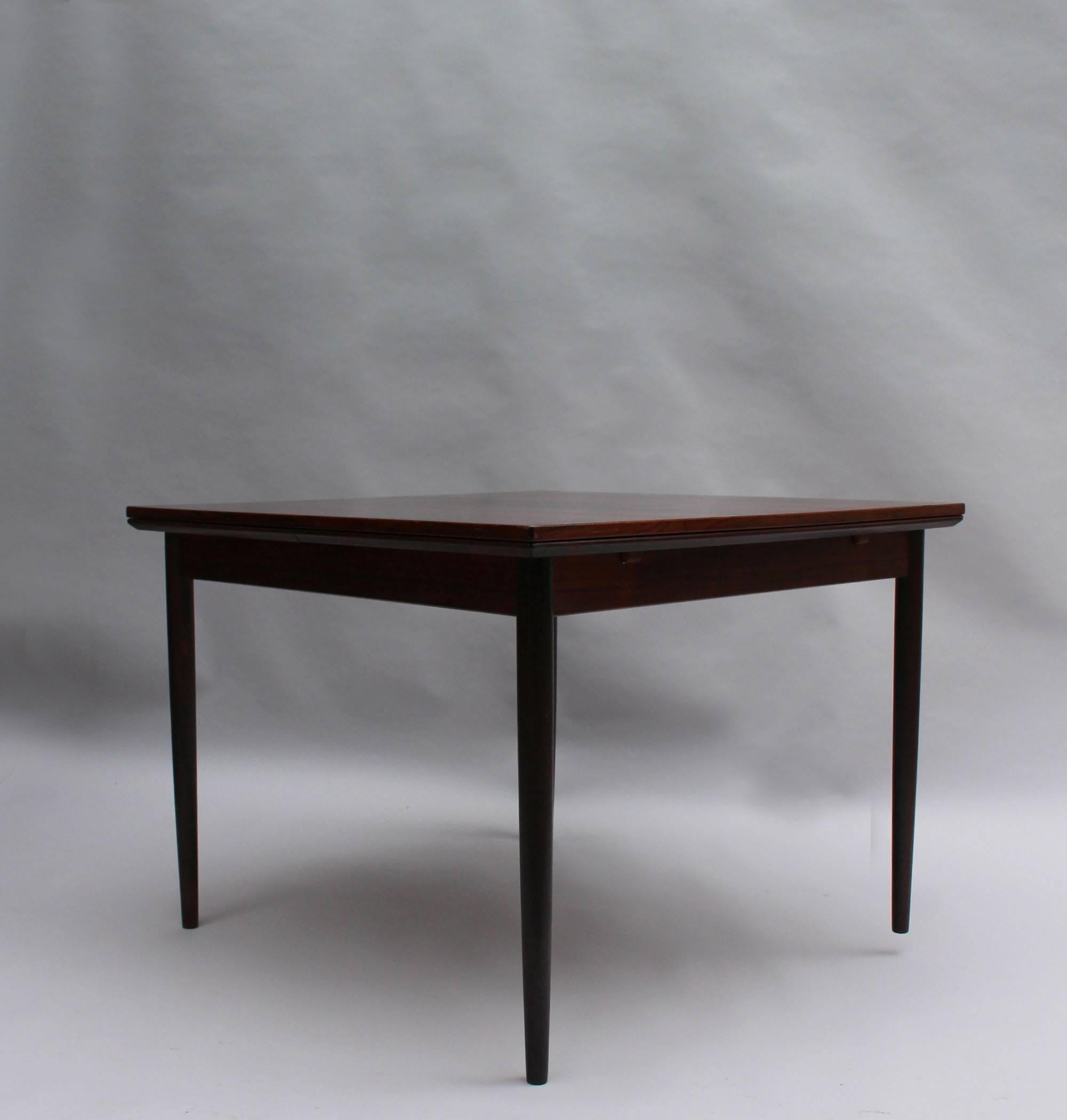 A fine mid-century square rosewood extendable Danish table by Svend Erik. Jensens Mobelfabrik
Length fully open is 78 3/4