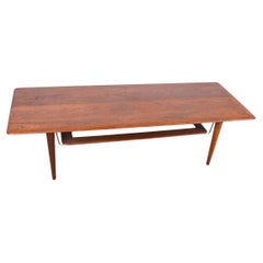 Danish 2-tier coffee table in teak, cane and brass model FD 516 by Peter Hvidt.