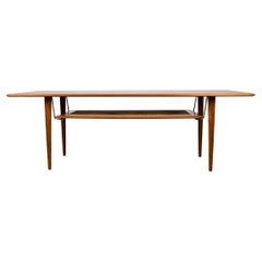 Danish 2-tier coffee table, teak, cane and brass model FD 516, Peter Hvidt 1960.