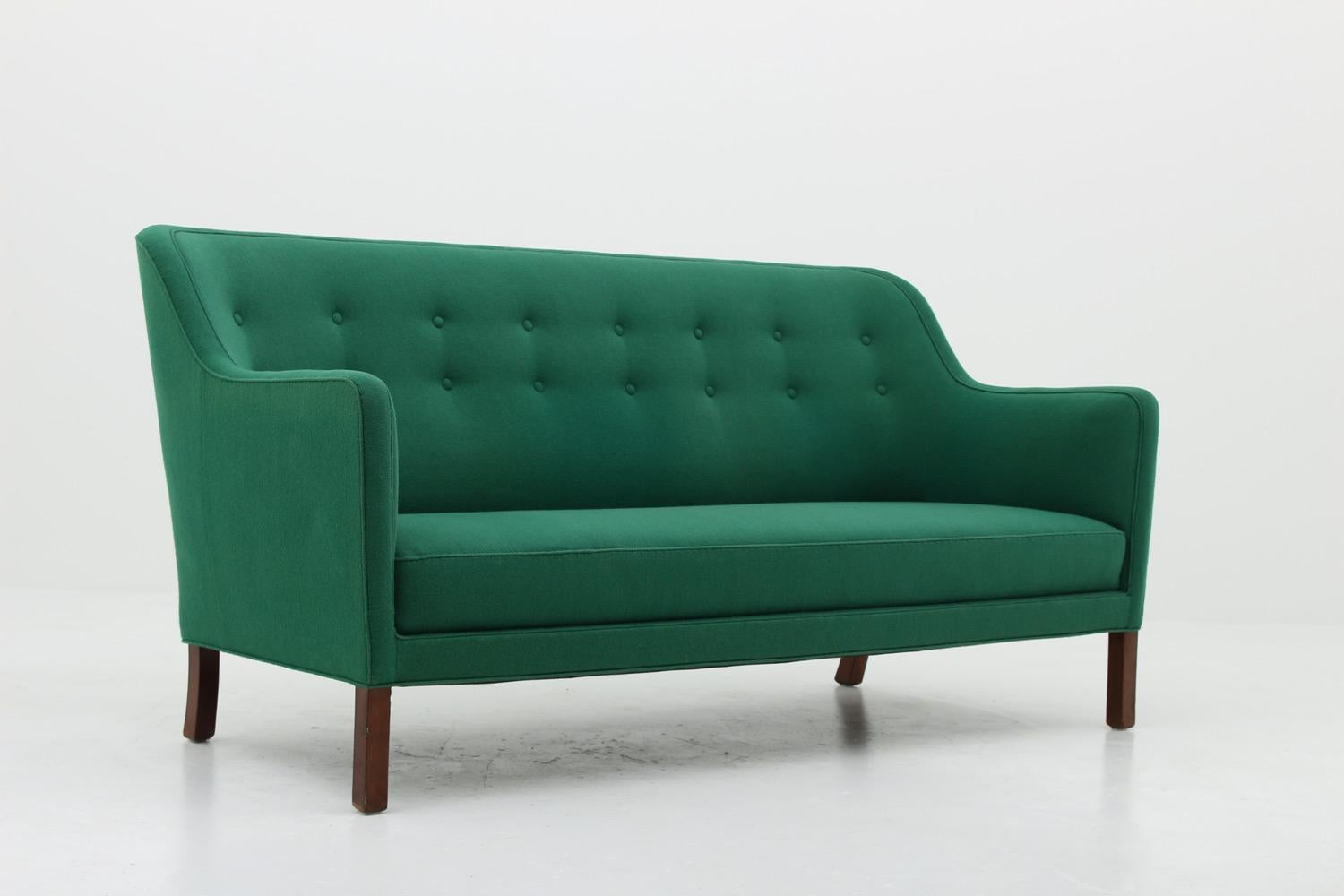 Beautiful Danish 3-seat sofa attributed to Jakob Kjær, 1960´s
This sofa is constructed with a high sense of quality. Its sober design is truly timeless and fits in any modern home.

Condition: Original green wool fabric. The fabric and springs are