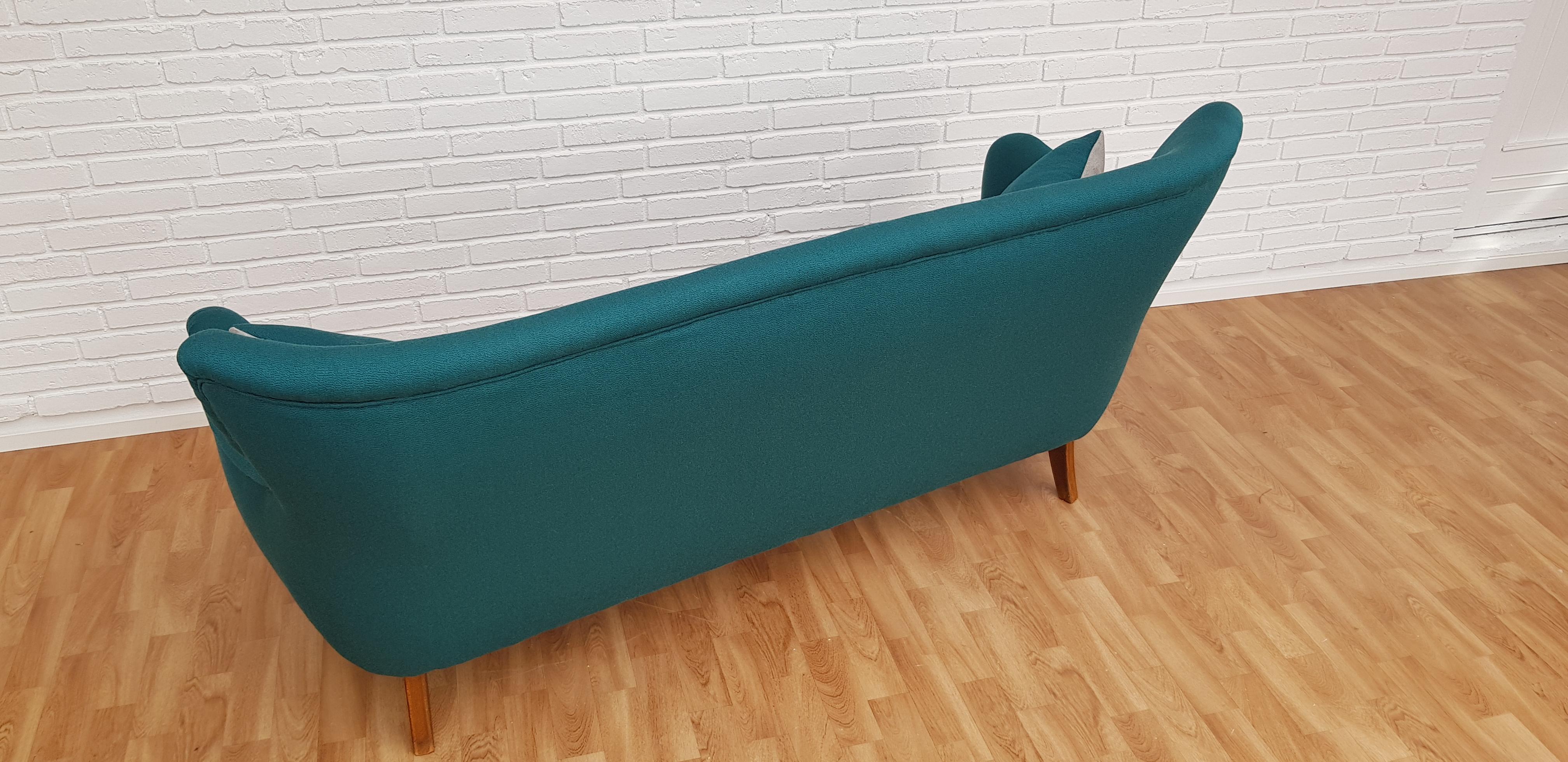 Danish designed, very nice 3-seat sofa. Made circa 1960 by Slagelse Møbelfabrik. Original brass springs in the seat. Completely restored in quality green-blue wool fabric by furniture craftsman at Retro Møbler Galleri. Double sided pillows.