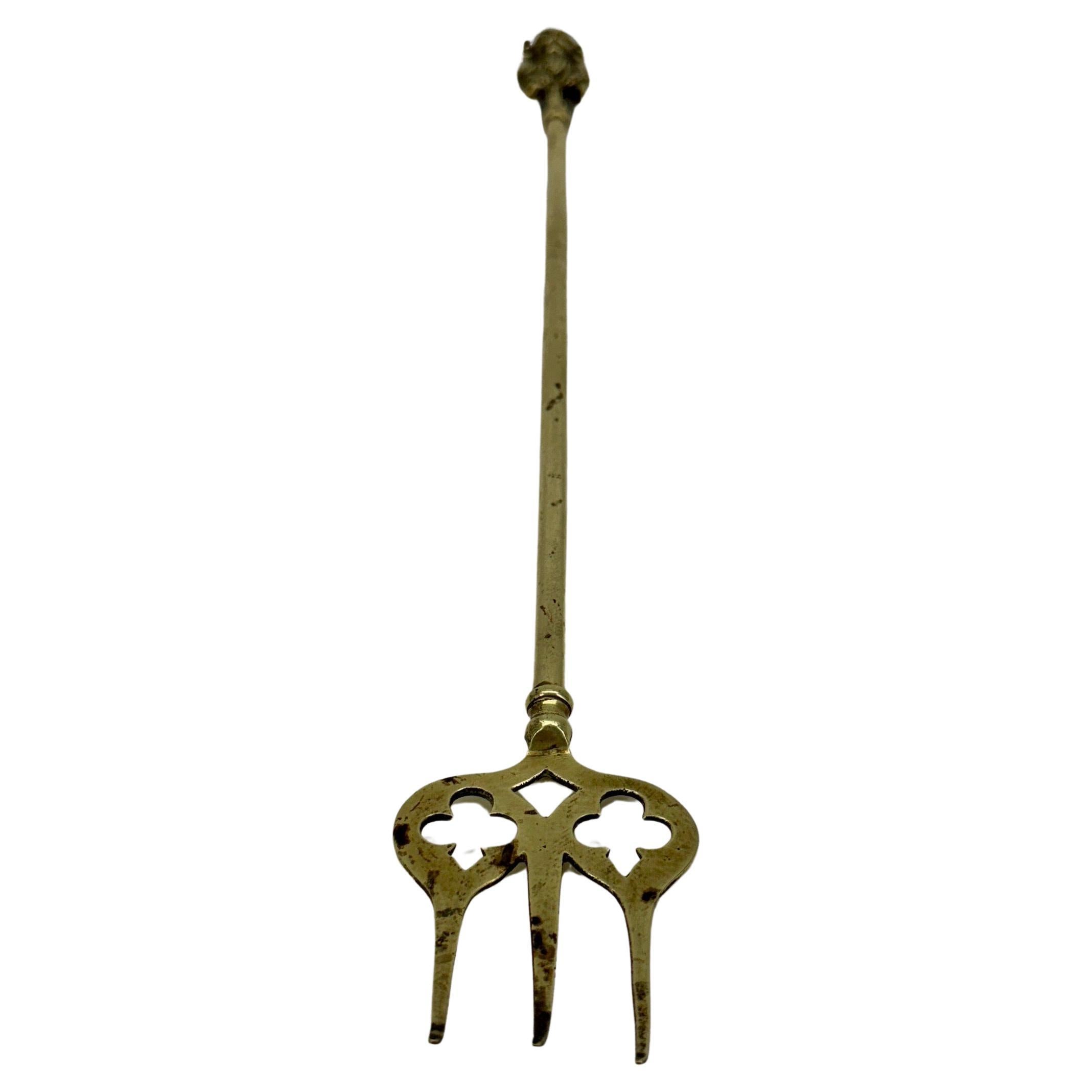 Antique Neptune shared brass fireplace toasting-fork tool.