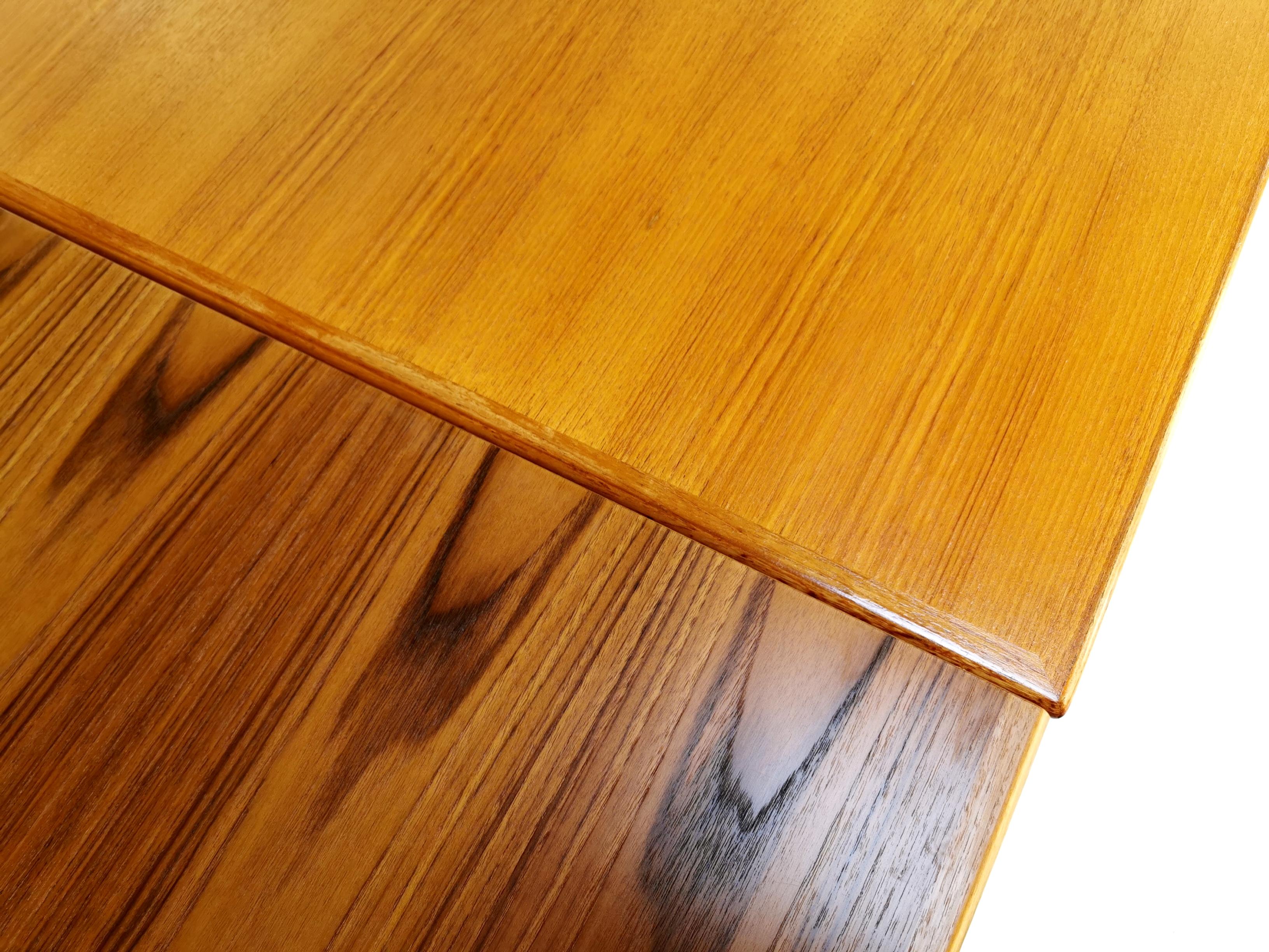 Danish teak extending dining table

A 1970s teak dining table by Danish company, AR.

Light, honey toned teak. 

Extends substantially, with the two additional leaves hidden under the tabletop, 

circa 1960s, Danish.

Dimensions (cm):? 92