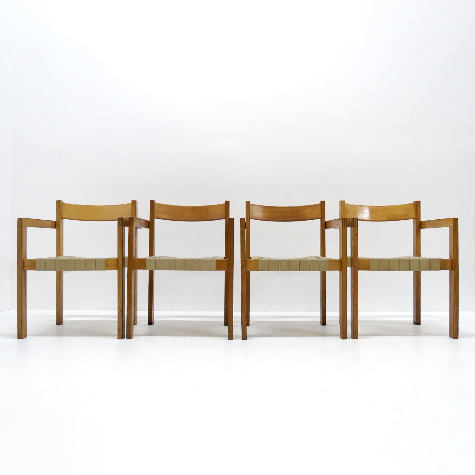 Wonderful 1960s dining chairs by Hans Wegner for GETAMA, with arms, in oak with straps of hemp, great patina, very comfortable. Priced individually. 3 chairs available.