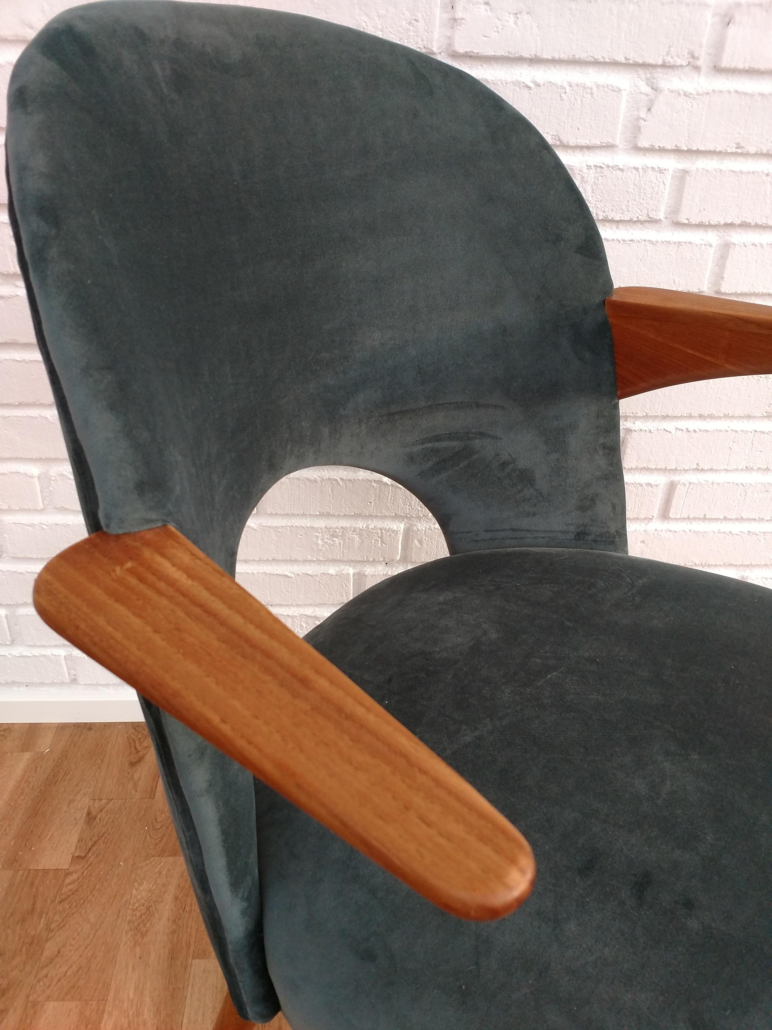 Armchair, with teak nails and legs. Danish design and Danish furniture manufacturer. Armchair produced circa 1950-1960. New reupholstered in green/ blue velour and completely restored by professional furniture upholsterer at Retro Møbler Gallery.
 