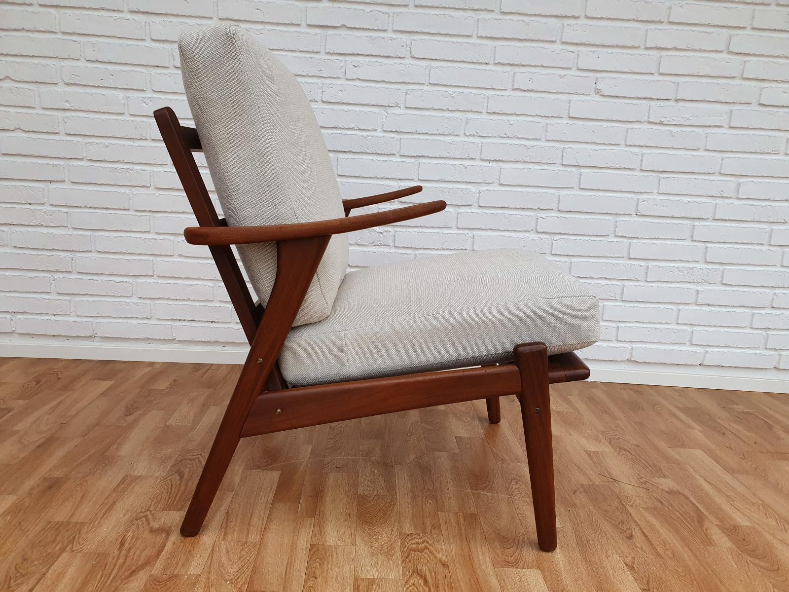 Solid teak armchair. Loose cushions. Orginal springs in the seat. Brand new padding. Wood construction has been renewed. Seat cushions upholstered in KVADRAT wool fabric designed by Nana Ditzel - Hallingdal 103. The fabric is very durable - 100.000