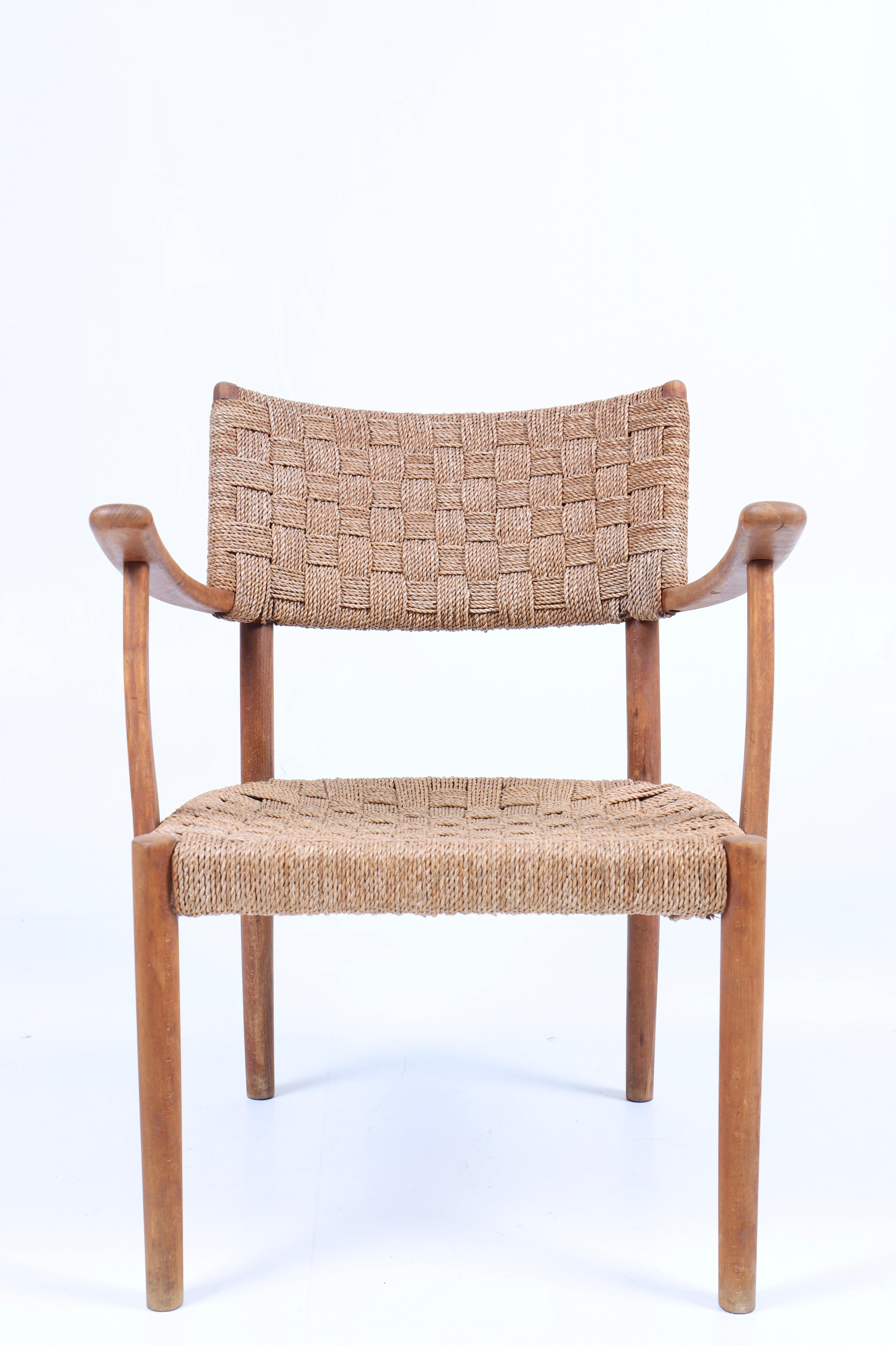 Armchair in beech and seagrass designed and made by cabinetmaker Fritz Hansen in the 1940s.