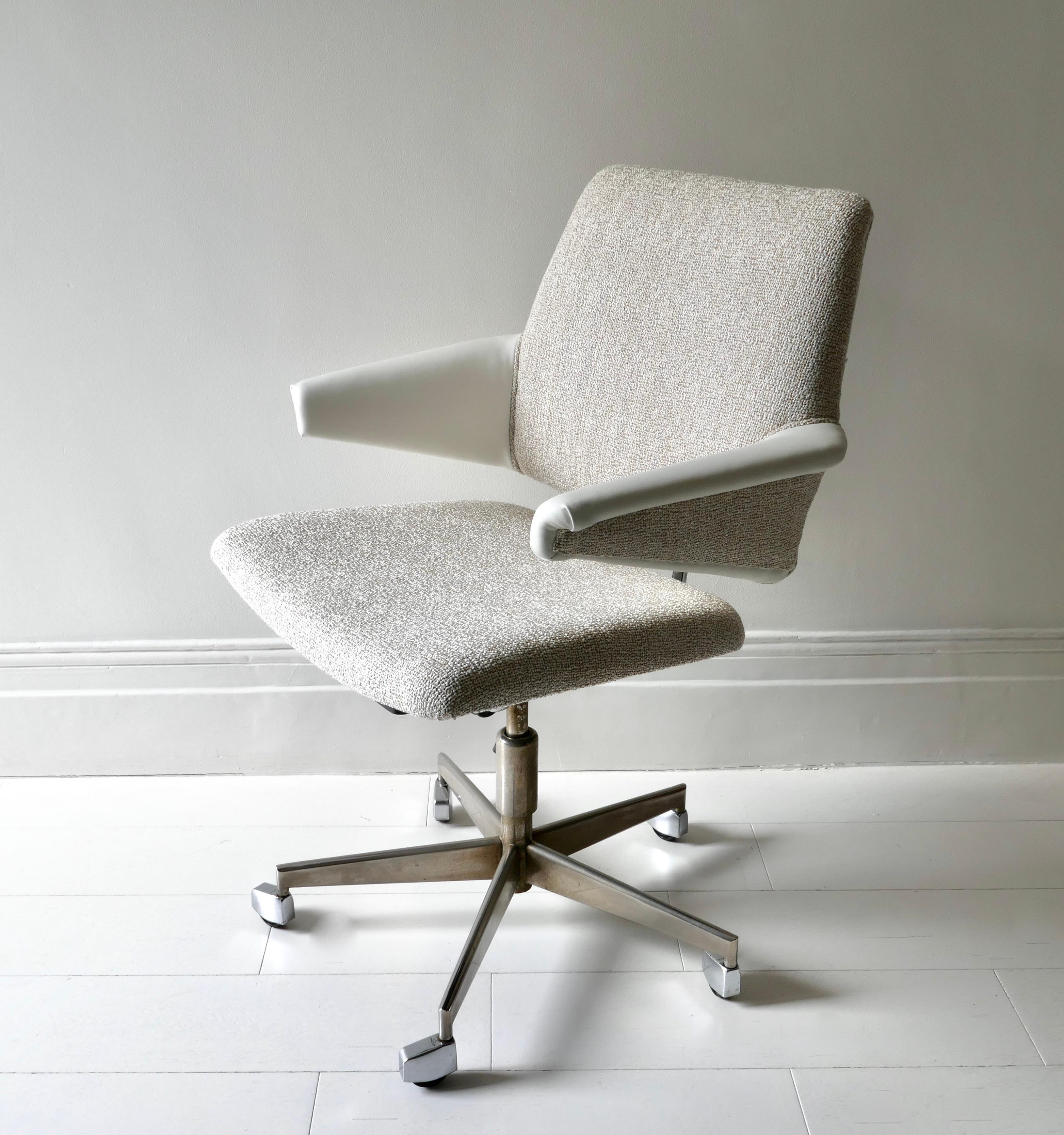 Office armchair designed by J. Jensen for Labof in the 1960s
The construction is made of chromed steel
Reupholstered with boucle fabric and man made leather armrest for longer resistance to time and usage. 
The armchair has the original manual