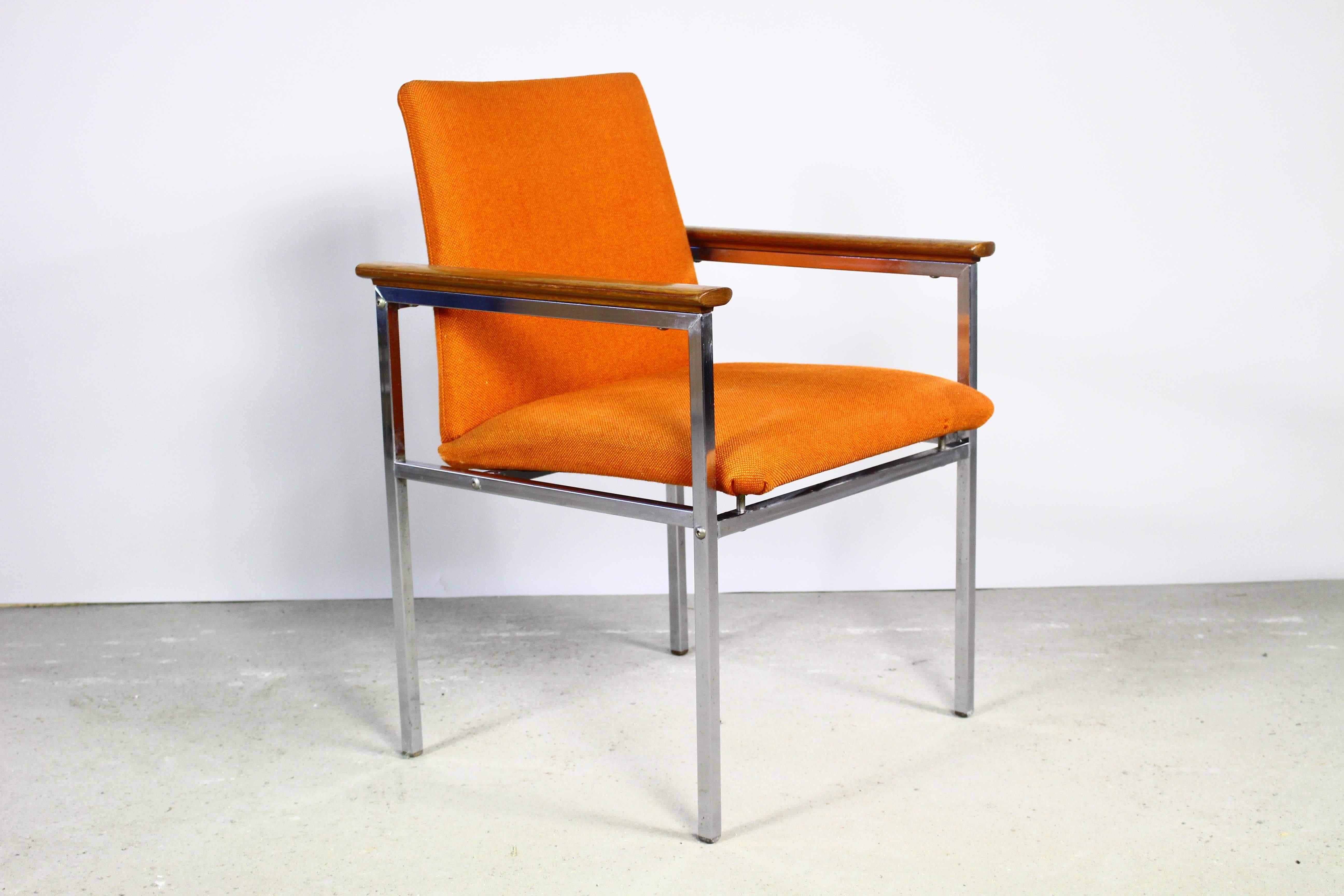 Scandinavian Mid-Century Modern armchair. 
Designed by renowned Swedish designer Sigvard Bernadotte and produced by Danish manufacturer France & Son.
A chromed steel frame with wooden armrests.
Armchair will be unfolded fot the shipping.