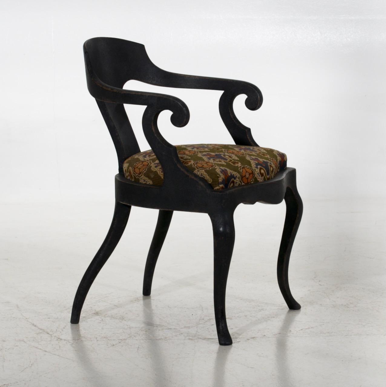 Danish armchair in black with original fabric, circa 1850.