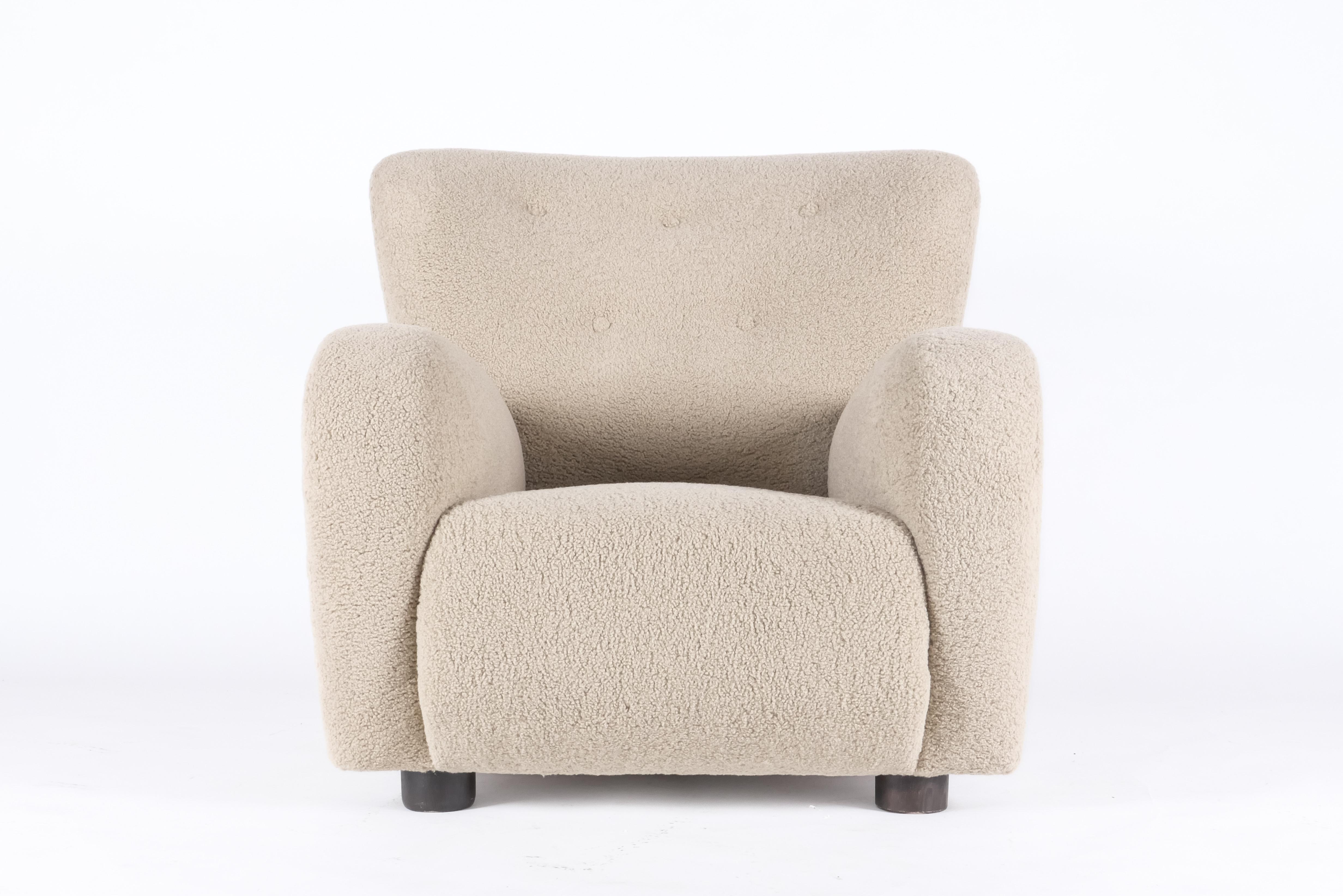 Large cozy armchair in the style of Fleming Lassen. Great chair for a reading nook or anywhere comfort is essential. Grand scale, built by a skilled Danish cabinetmaker ensuring quality construction. Reupholstered in Italian alpaca bouclé. Beech