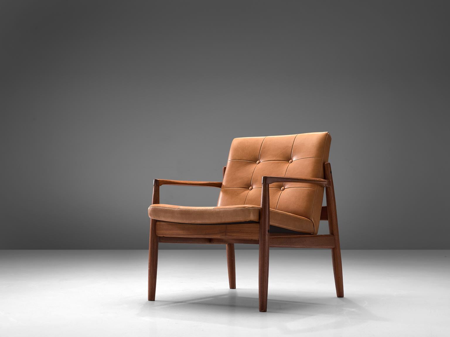 Armchair, walnut and oak, Denmark, 1950s

This lounge chair in oak presents an open-arm frame. The chair is upholstered in a rich cognac fabric which shows a subtle patina. This design features elegant details such as the pointy armrests that are