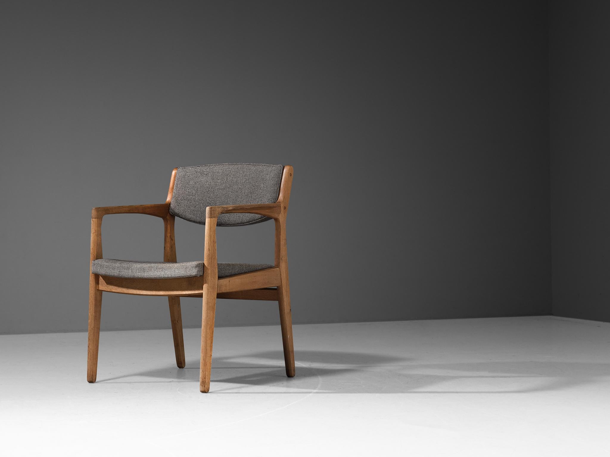 Armchair, oak, fabric, Denmark, 1960s. 

The style of this armchair is characterized by simplified lines, absence of decoration and the use of neutral materials that are in great harmony. The sculpted frame proofs the great eye for detail and