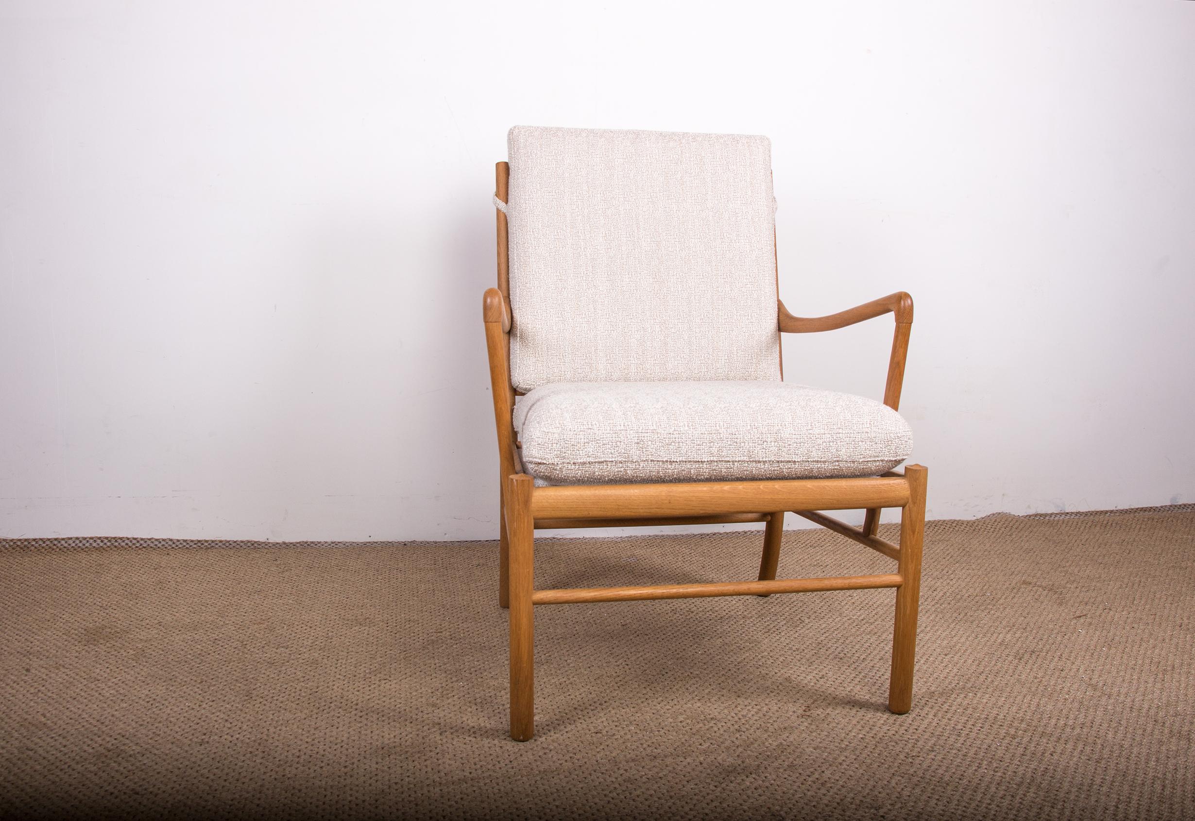 Superb Scandinavian armchair. Backrest and seat completely redone in cream terry fabric. Remarkable woodwork, finesse and elegance. Very high comfort. Very nice piece of furniture.