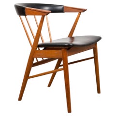 Danish armchair in teak and skai by Helge Sibast for Sibast 1955.