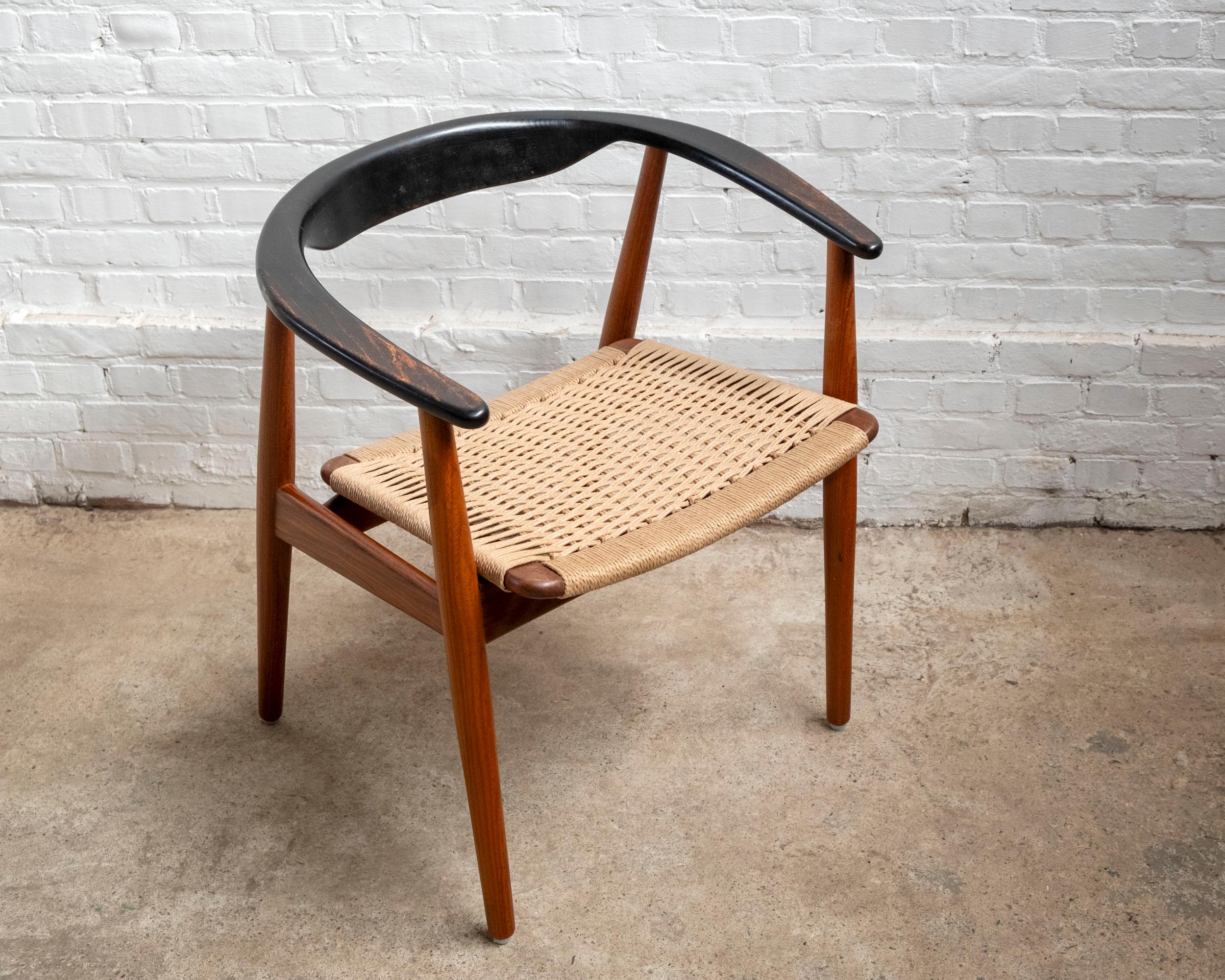 Superbly designed and crafted armchair in teak with a seat woven in danish papercord. The designer is unknown but the chair resembles the style of Illum Wikkelsø and Henry Kjærnulf. Would be beautiful with a freestanding desk or in a mix of chairs
