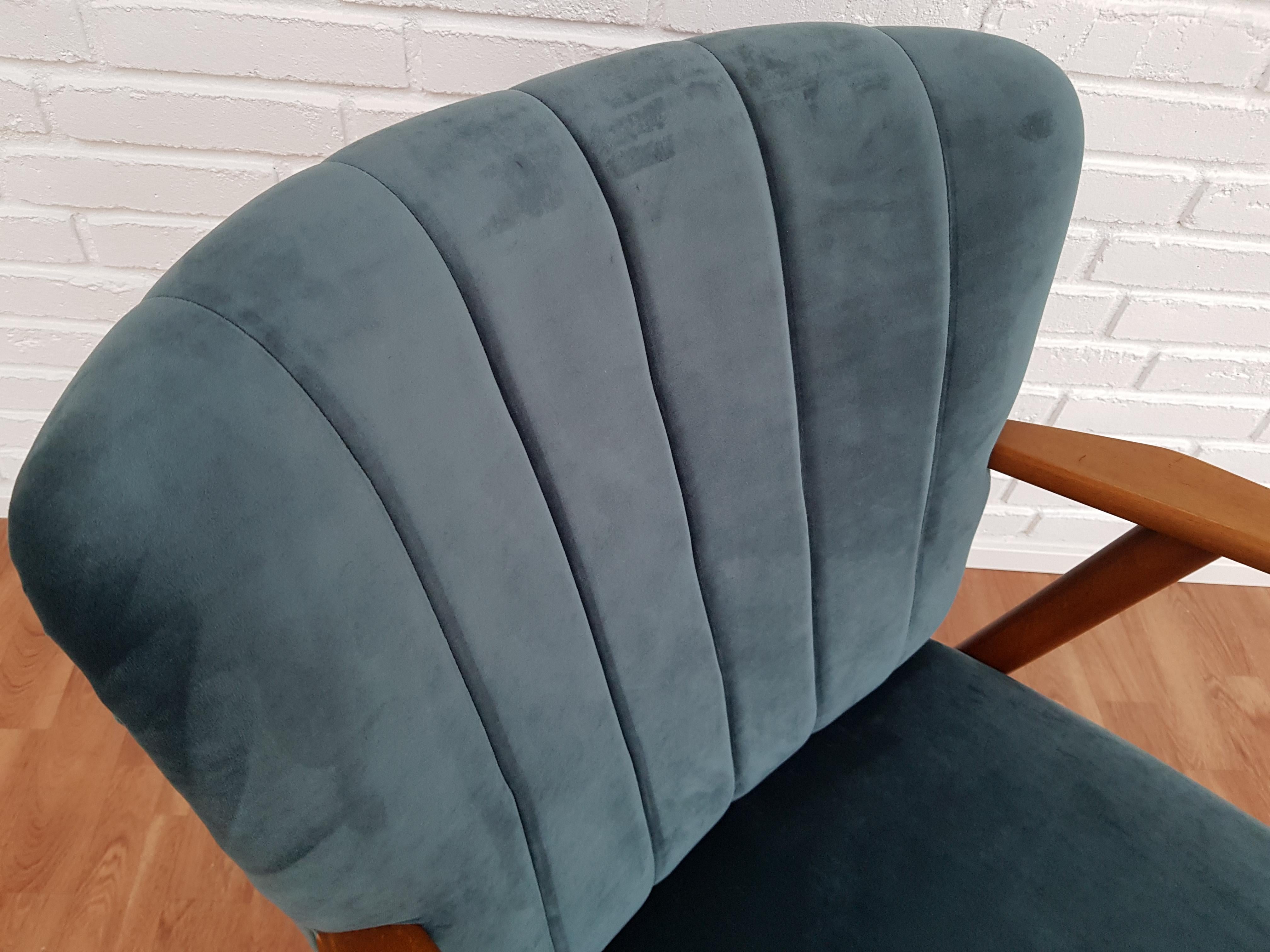 Danish designed armchair. Produced in about 1960 by the Danish furniture manufacturer. Beech wood. Completely renovated by craftsman, furniture upholsterer at Retro Møbler Galleri. Brand new padding. New reupholstered in quality green or blue