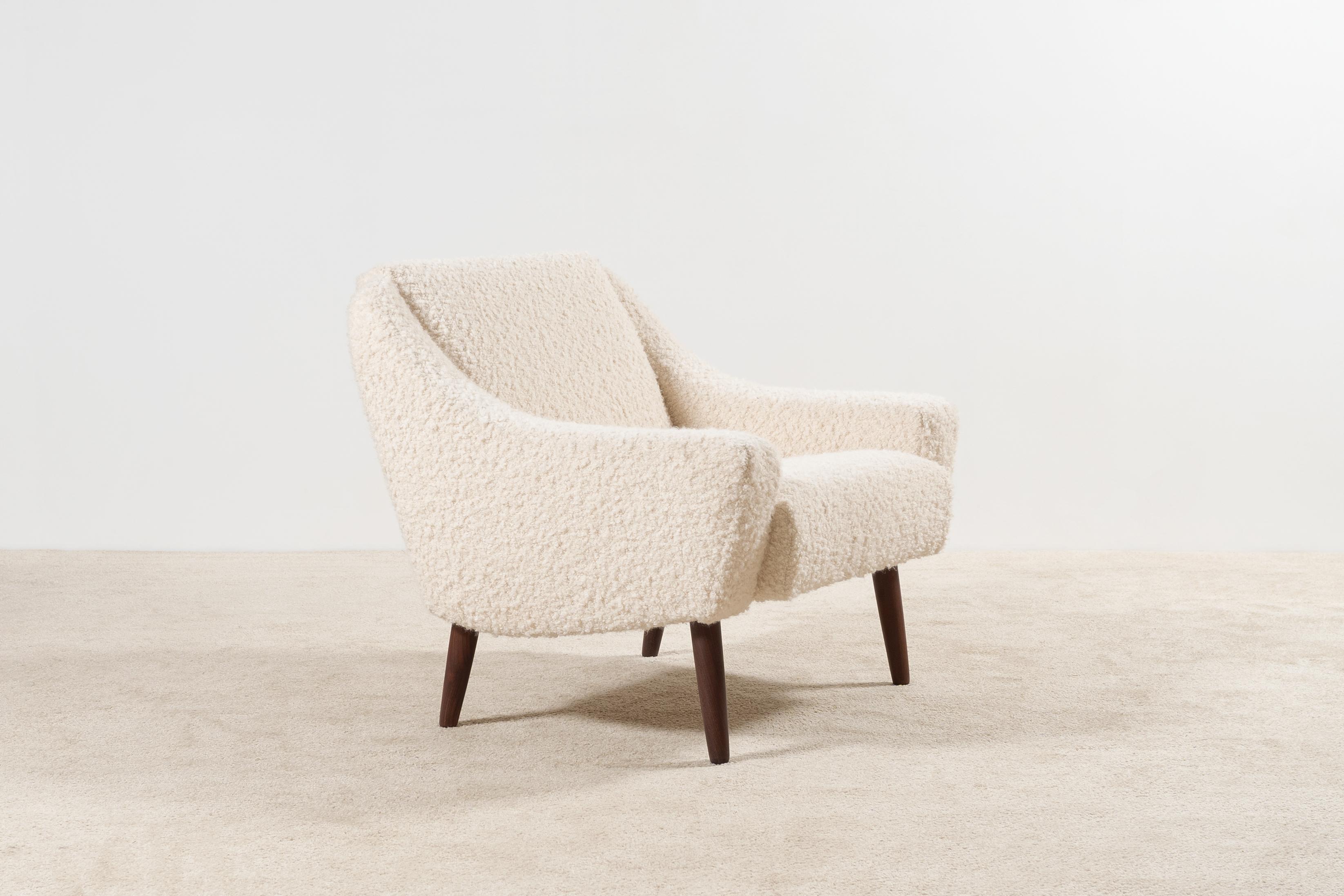Lovely single Danish armchair with nice curves, circa 1960.
Unknown designer. Nice teak feet.

Original piece from the 60's fully restored and newly upholstered in the traditional way by the best French craftsmen with a Nobilis wool Bouclé