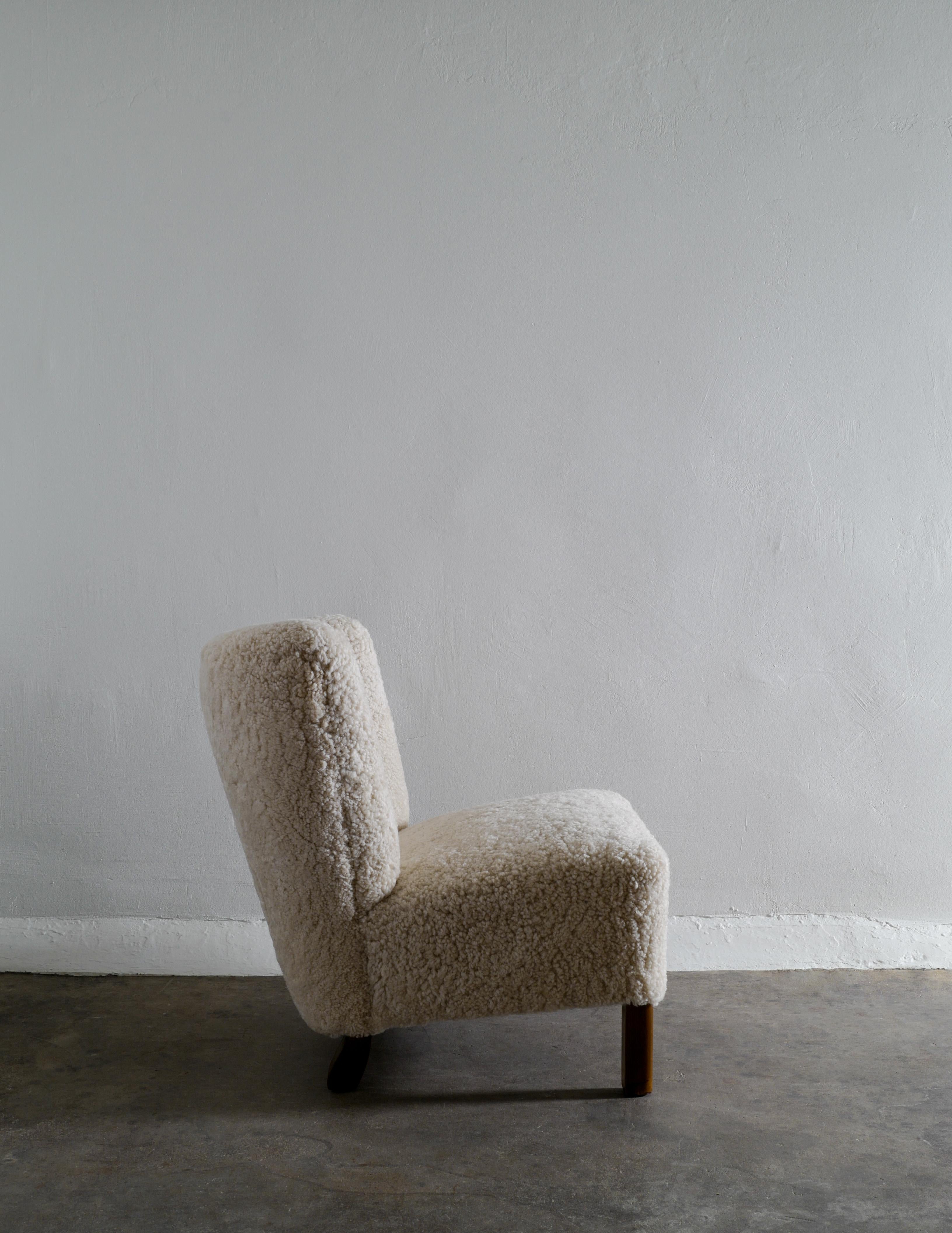 Scandinavian Modern Danish Armless Easy Lounge Chair in Sheepskin Produced in Denmark 1940s