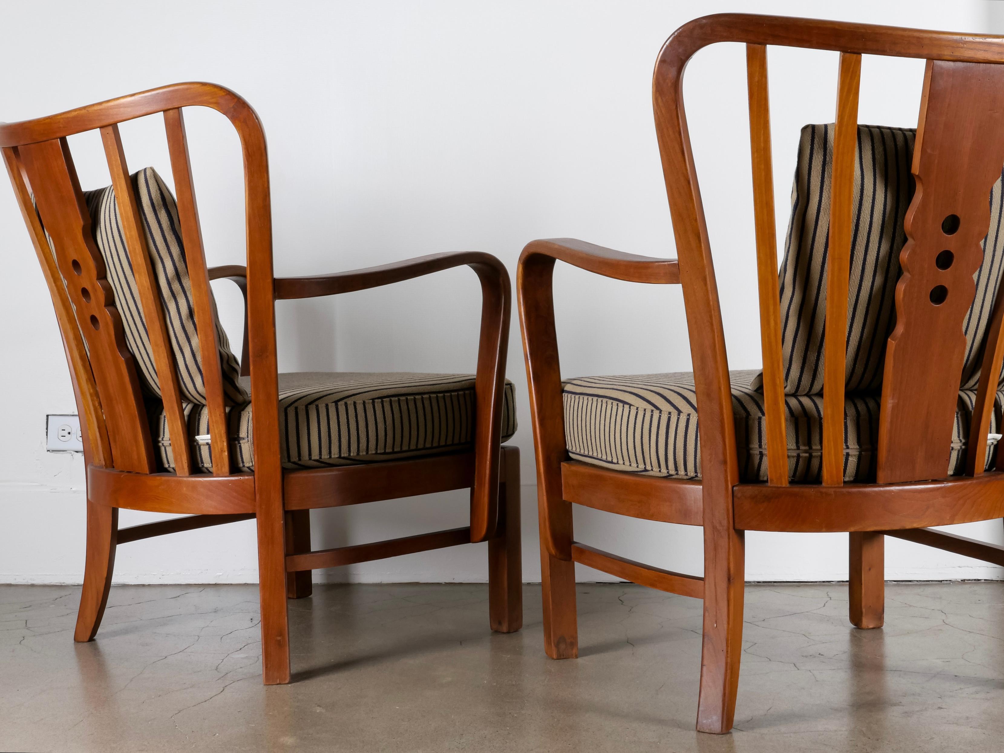 Wonderful pair of lounge chairs imported from Denmark. Model 1588, made by Fritz Hansen during the 1930s. Solid oak frames and freshly upholstered striped Danish wool cushions. Rare and in excellent vintage condition. Sold as pair. 