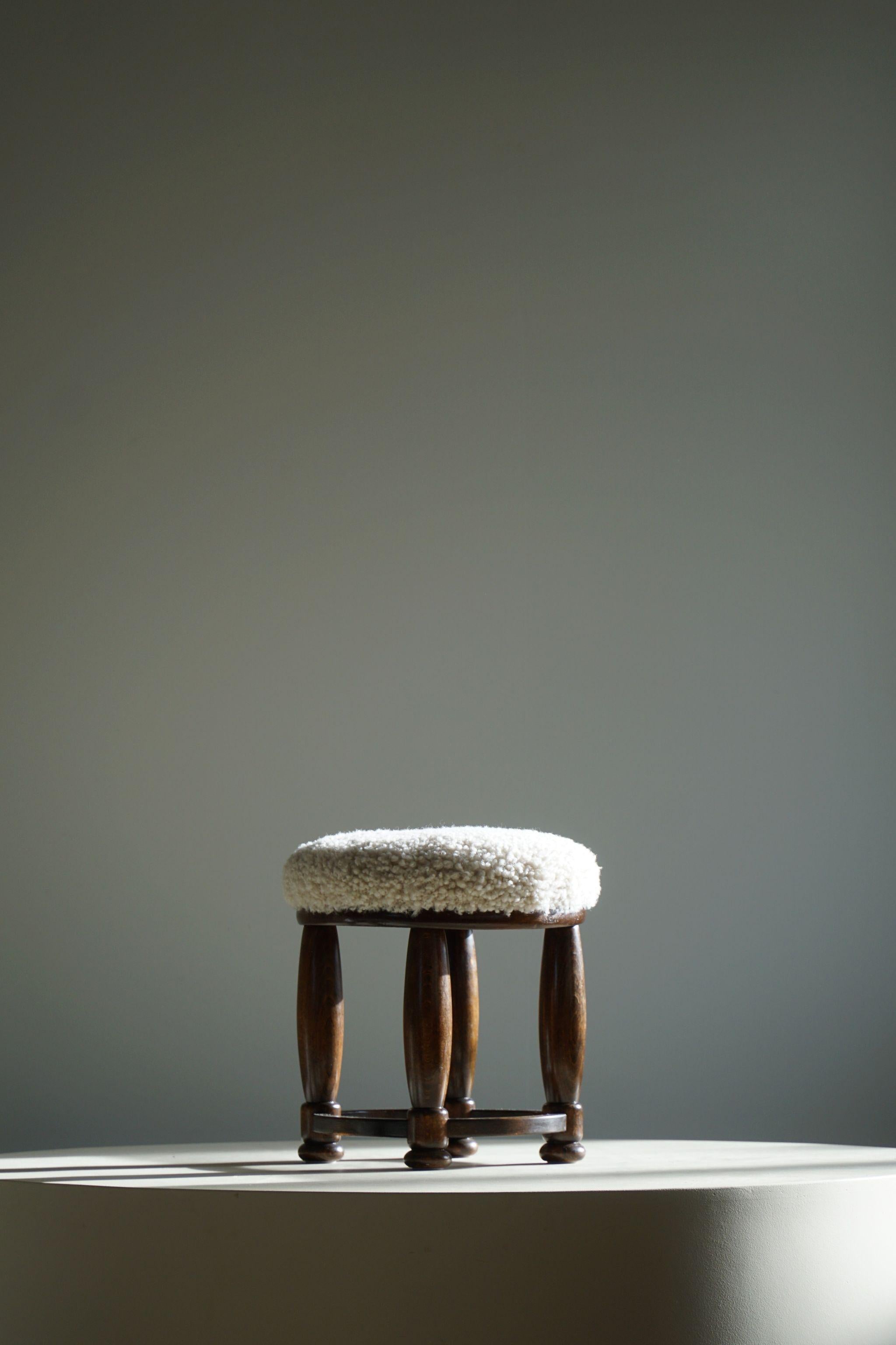Scandinavian Modern Danish Art Deco, A Round Footstool, Reupholstered Seat in Lambswool, 1940s For Sale
