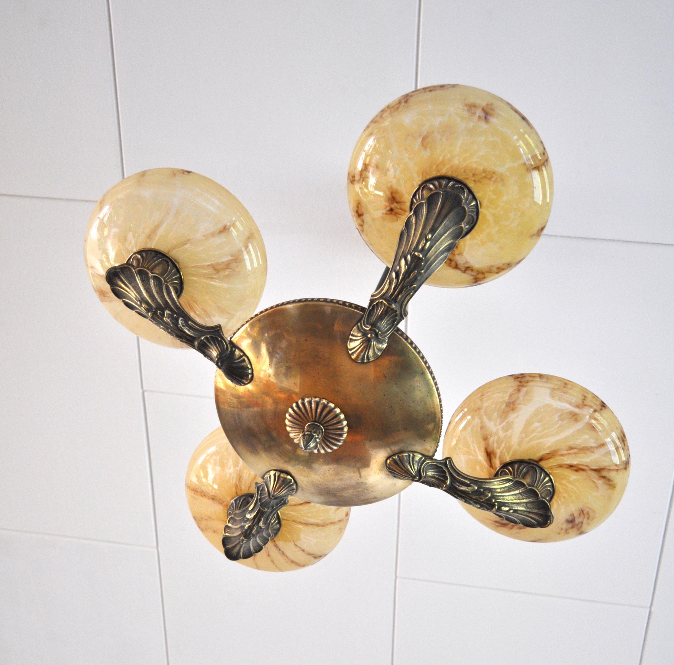 Antique Danish Art Deco Chandelier composed of 4 marbled opaline glass lights with solid brass arms and black painted metal stem, 1920s-1940s. 
Excellent condition, fully restored and rewired.

Light source: E27 Edison screw fitting, rewired.