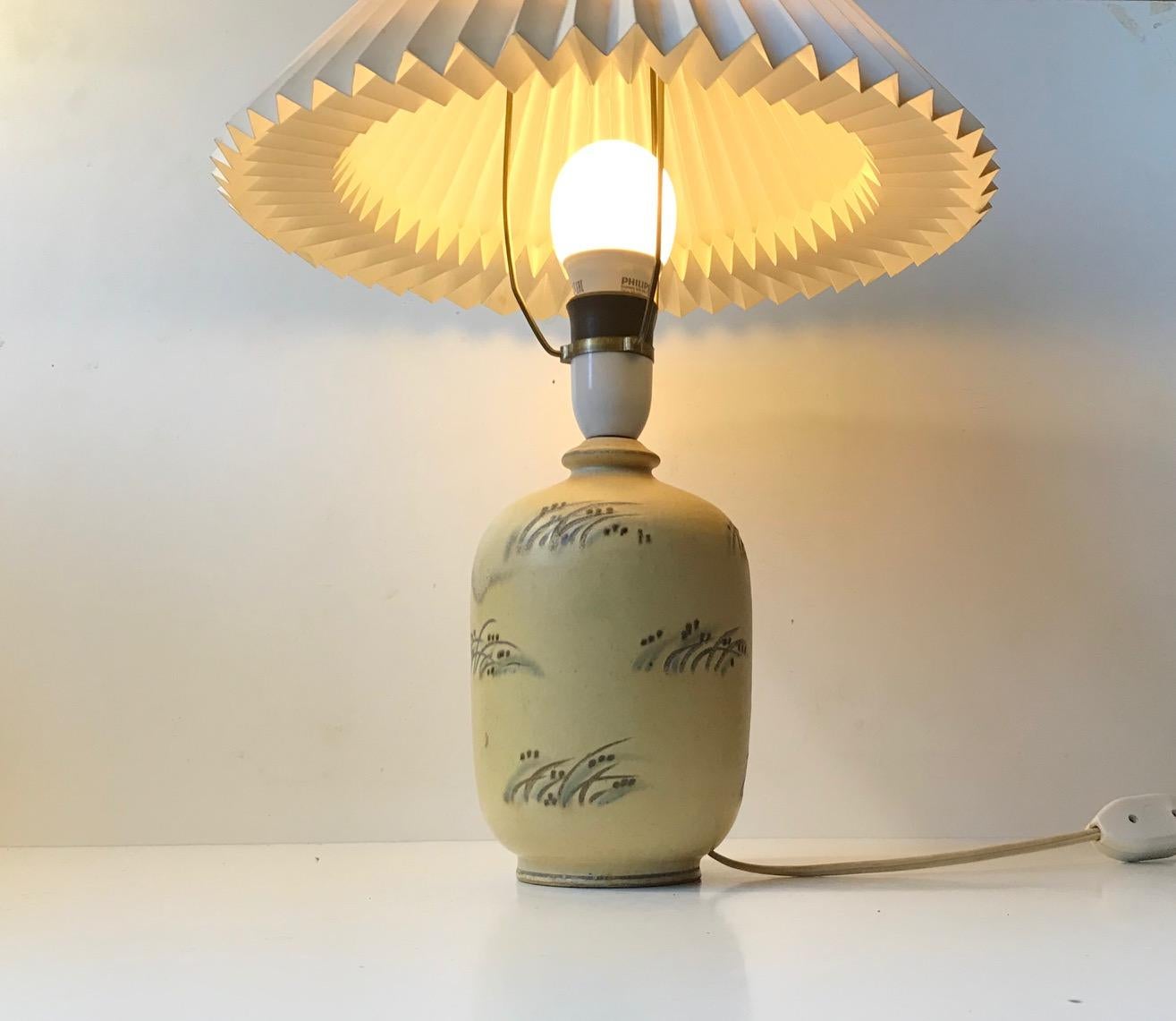 Gourd shaped earthenware table light designed and manufactured by Knabstrup in Denmark during the 1930s. Hand decorated with sea weeds on dusty pastels and earthy colors. The table lamp comes without a shade. Please personalize by picking your own.