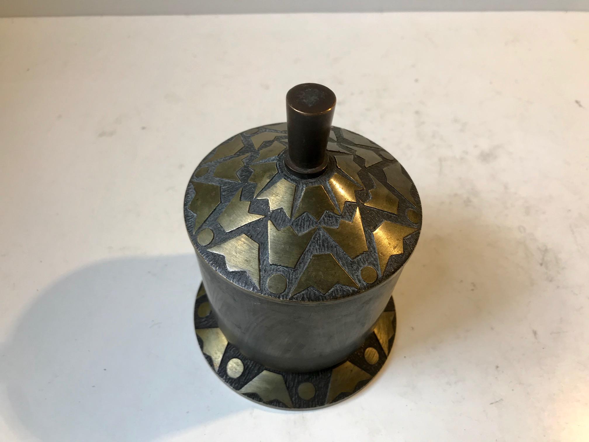 Lidded bronze jar, trinket or cigarette container decorated with crown motif's. Manufactured and designed by Nordisk Malm in Denmark during the 1930s in a style reminiscent of Tinos and Argentor.